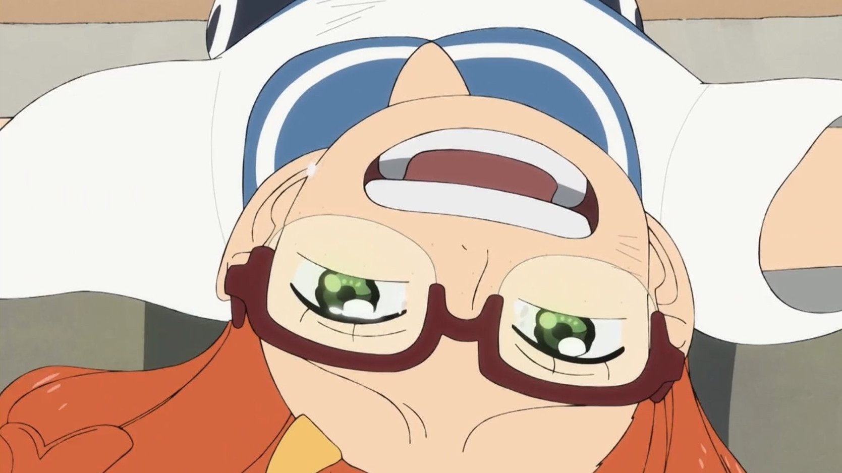 A screenshot from the One Piece Fan Letter episode. The image is of the Ni Fan girl smiling and on the verge of tears as she lays upside down after seeing Nami.