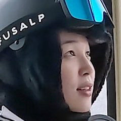 Zoomed in pic of Jimin with snow gear on, googles lifted up on his helmet so you can see his face.