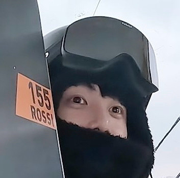 Zoomed in pic of Jungkook with snow gear on covering half his face so I you only see his eyes and nose.