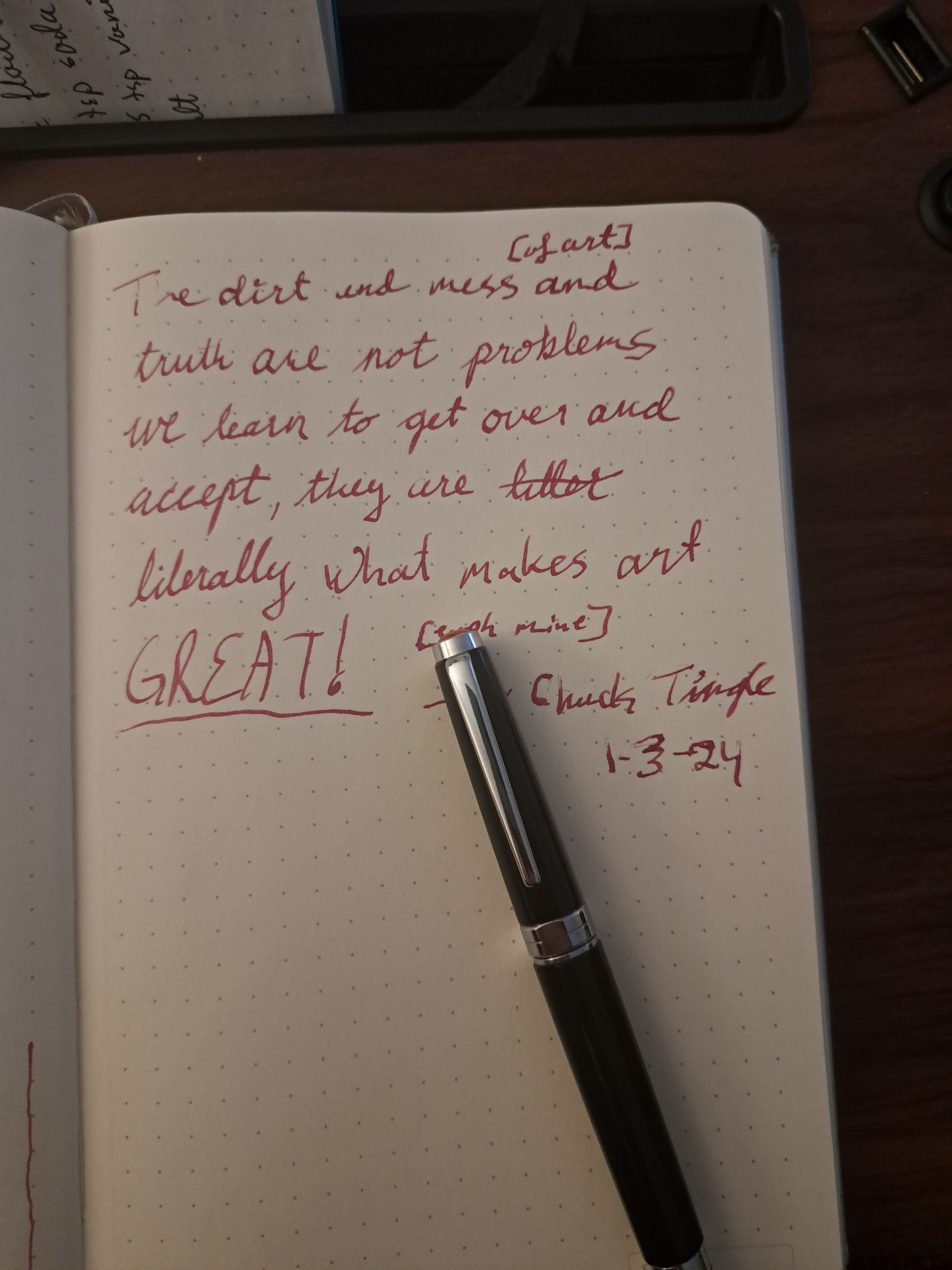 A portion of a Chuck Tingle skeet handwritten in a notebook with a fountain pen sitting on top.