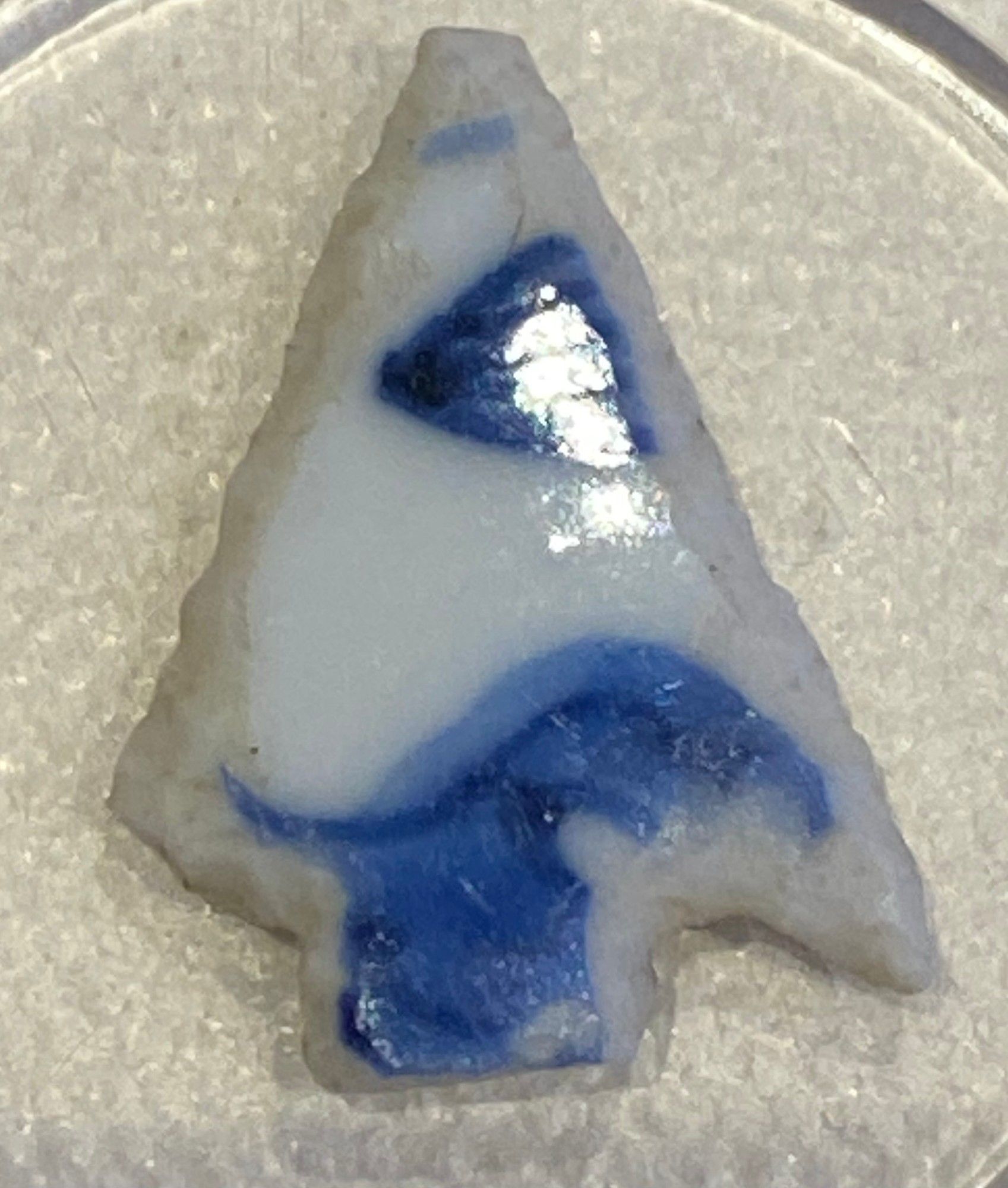 A projectile point made from blue-and-white Chinese porcelain