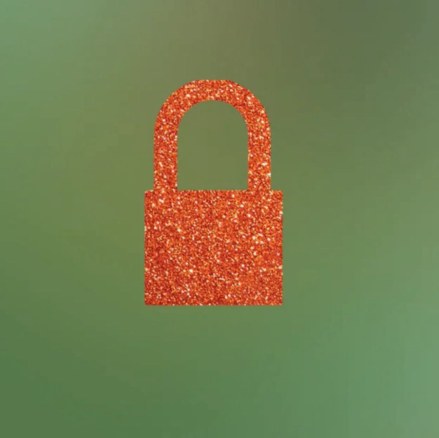 Blurred green/ aqua background with a glittery ornage lock on top. This is now Taylor Swift’s and Taylor Nation’s PFP