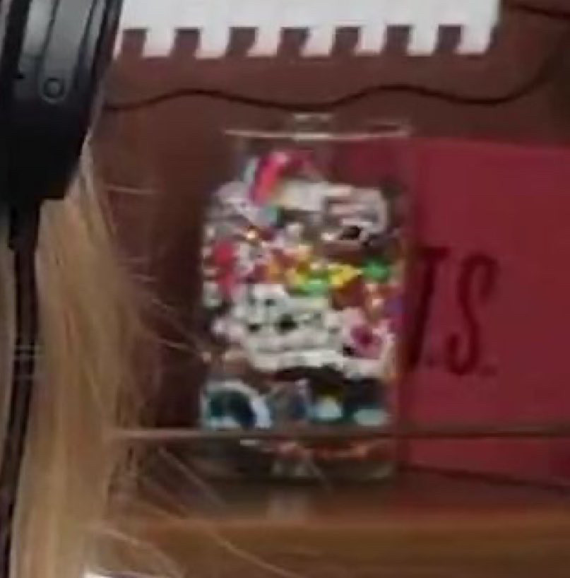 Screenshot of Taylor Swift’s preview as a guest on the “bew heights” podcast showing a TS on a red cover on the background 
