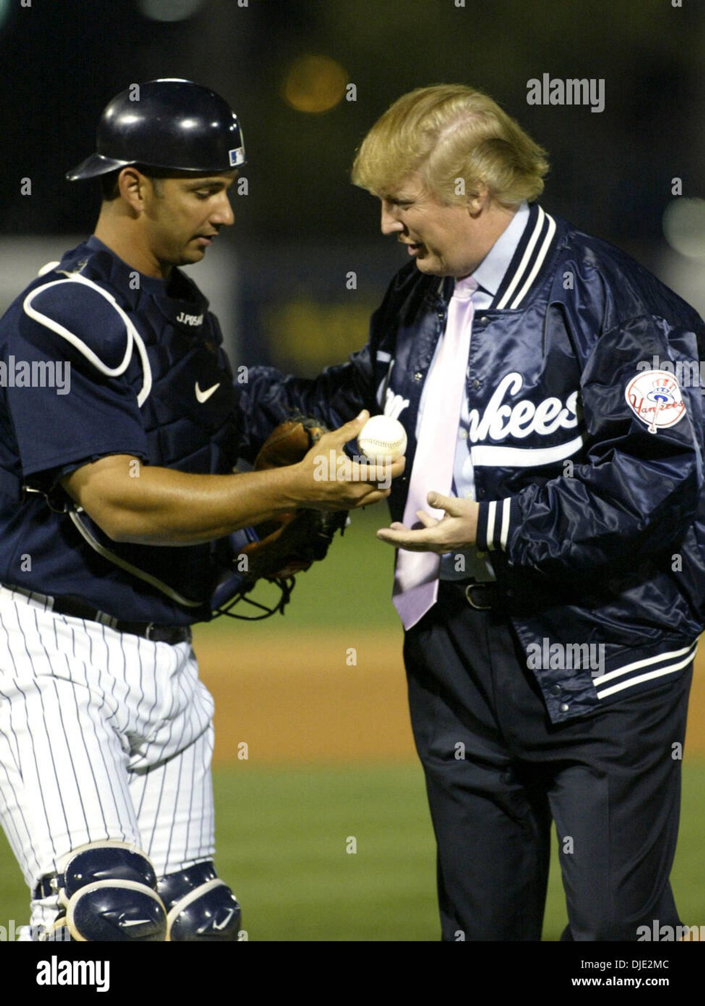 Yankees catcher Jorge Posada giving a call to insurrectionist Donald Trump after throwing out the first pitch.