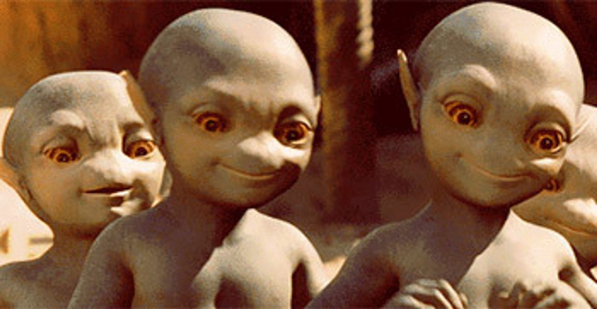 Still from the move Galaxy Quest showing three cute baby aliens.