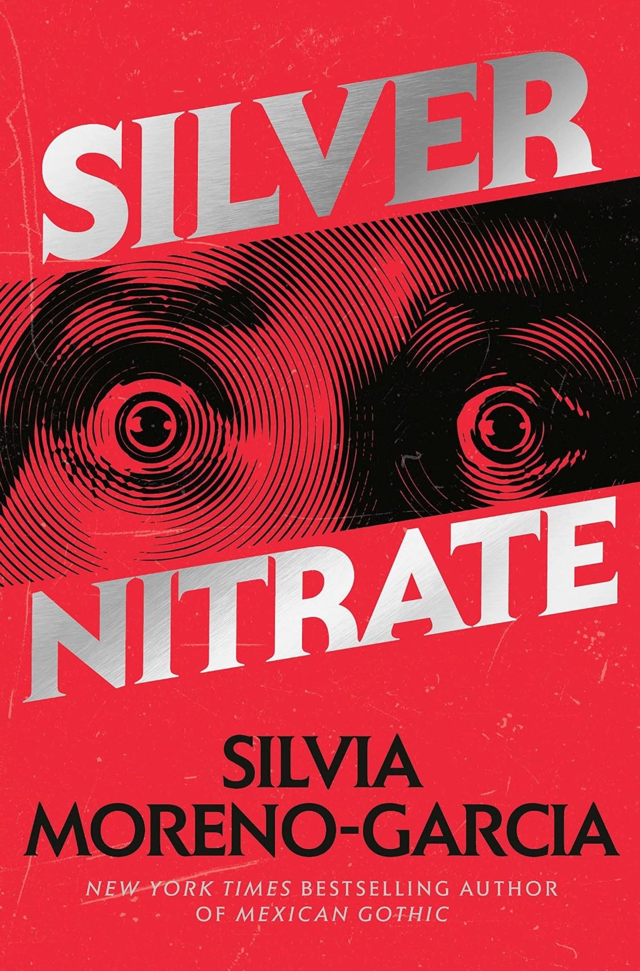 Book cover of SILVER NITRATE, by Silvia Moreno-Garcia. Wide, scared eyes stare out of a bright red cover, and the title is in shining silver letters.