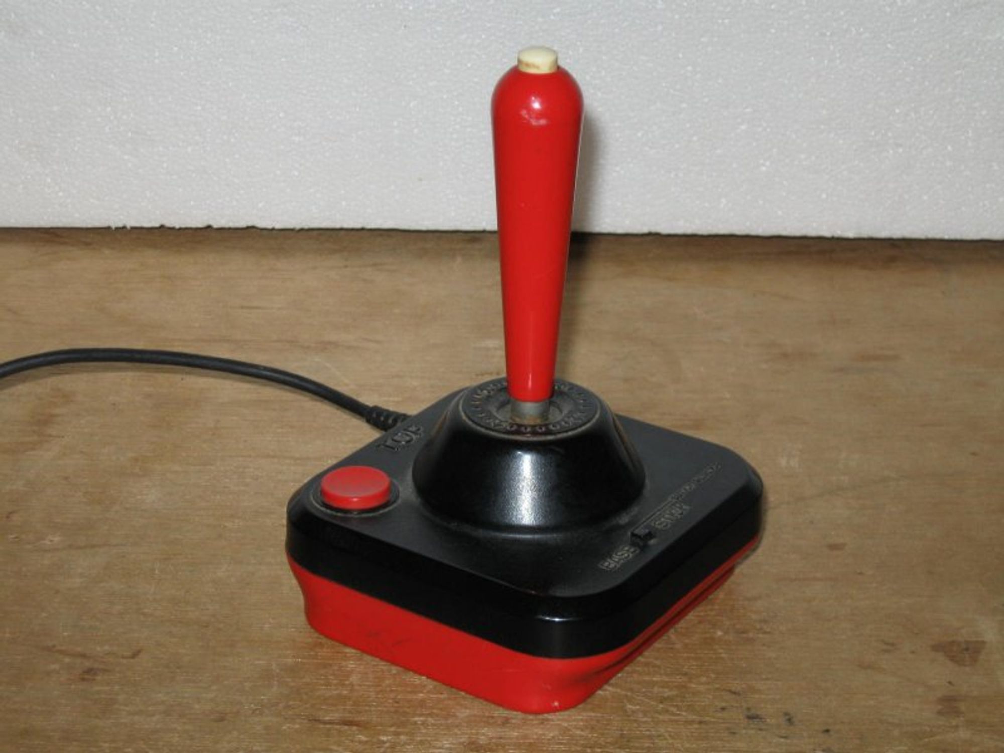 Wico Command Control, a joystick for Atari consoles and anything else compatible. It has two buttons, one on the base and one on top of the stick, selectable by a switch on the base.