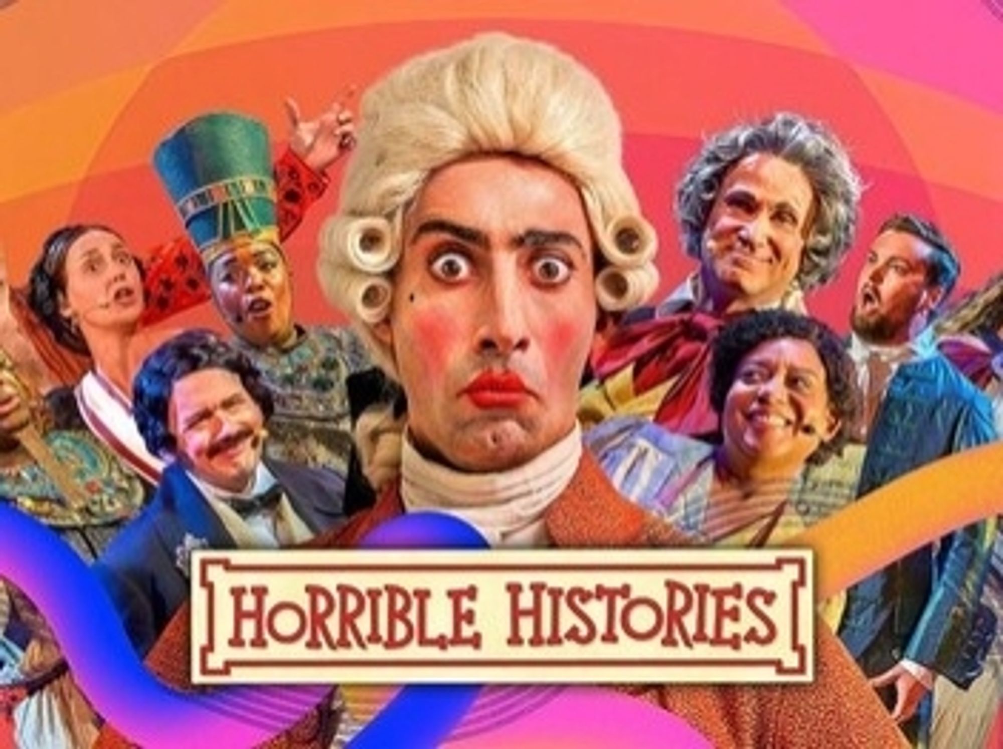 Horrible histories. A picture from the later series which I write for. A man dressed as a Georgian dandy stares at us, surrounded by people in different period dress