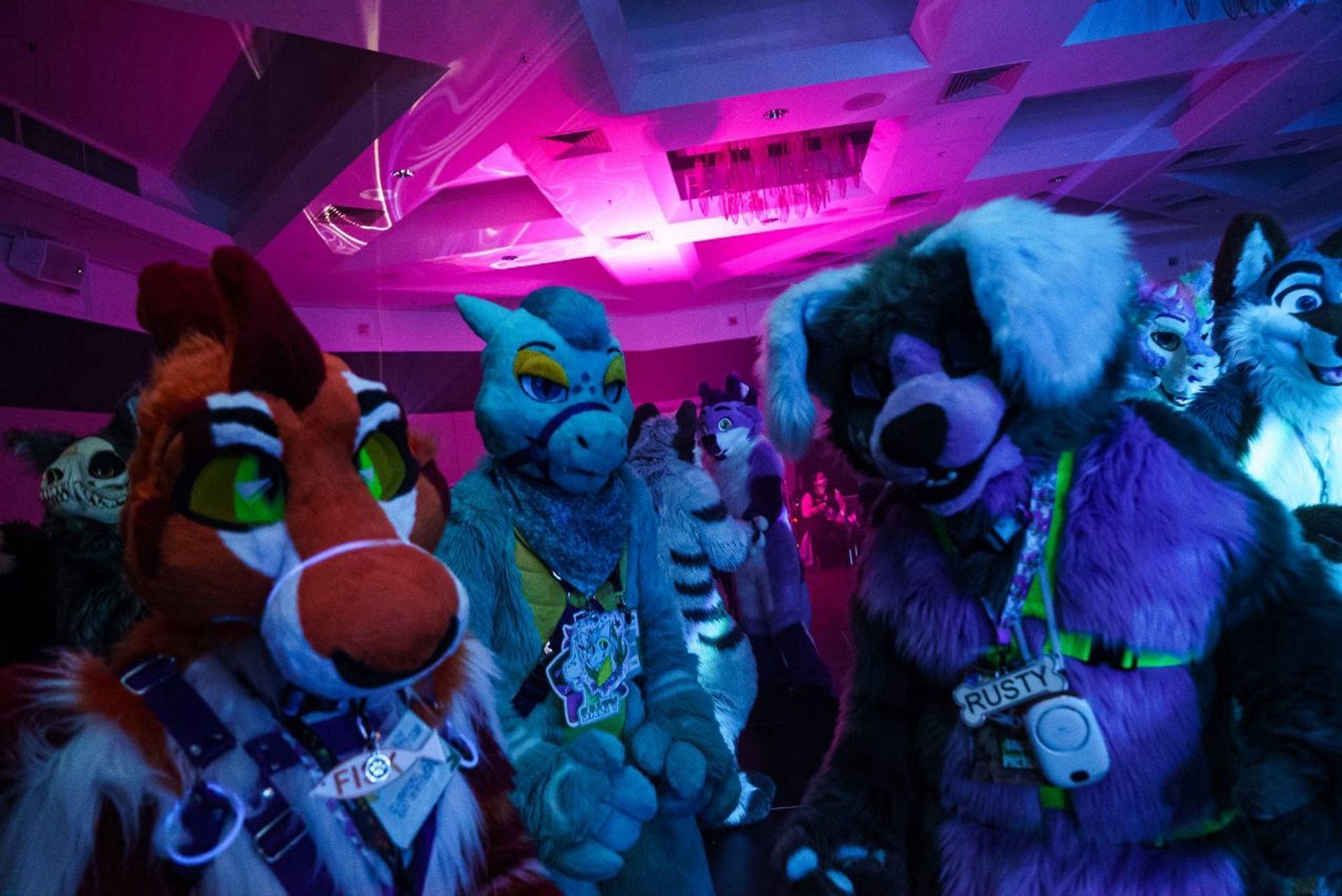 3 fursuiters dancing together at the Sunday night rave at Furdu 2024