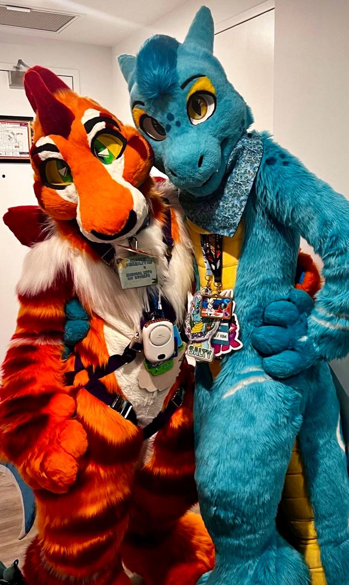 A shark and a aquatic dragon fursuiter ready to go to the rave at furdu 2024