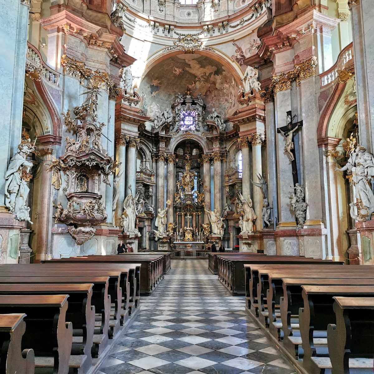 The interior of the baroque and very ornate St Nicholas Church in Prague