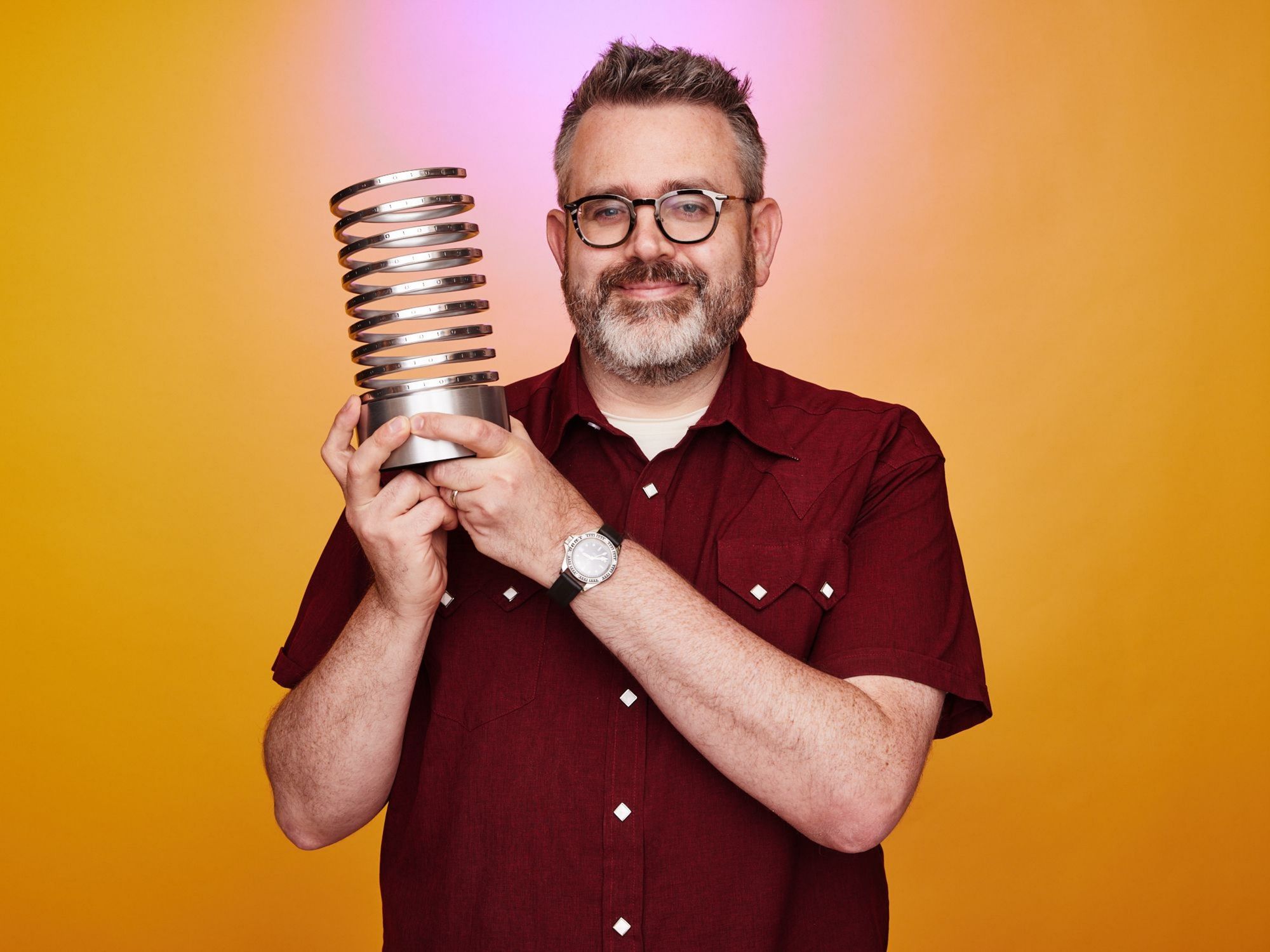 Me holding a Webby Award statuette.