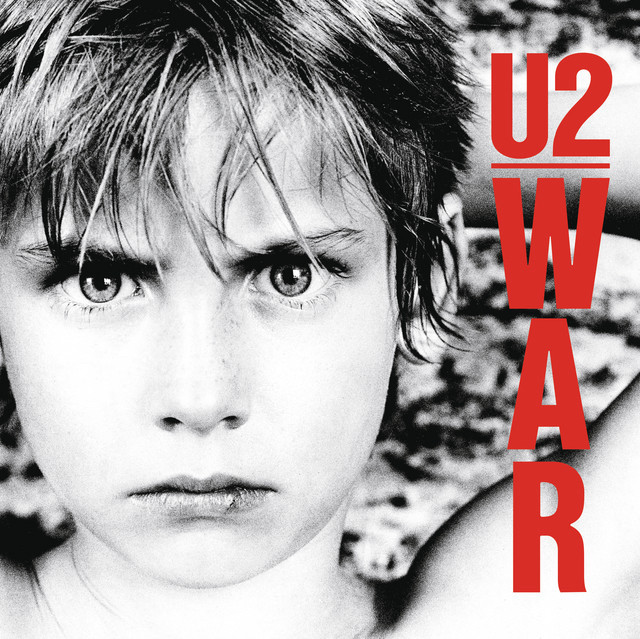 The cover of U2’s War album with a cover of a young boy looking sternly on the cover 