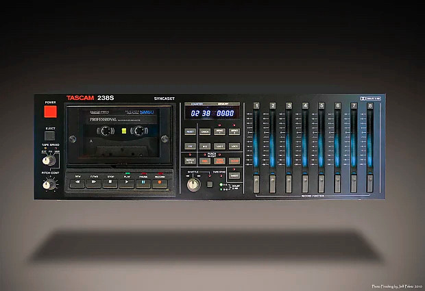 A Tascam 238s Syncaset, a rackmount 8 track with LED meters on the right and a digital control section in the center