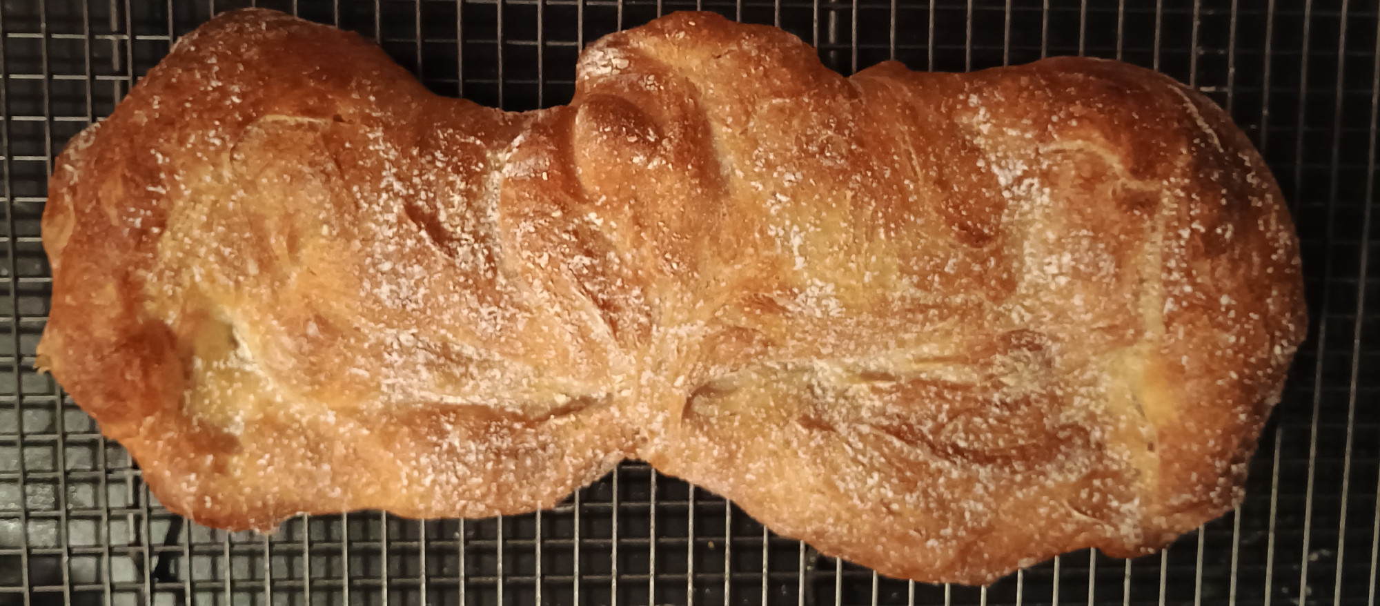 Deeply golden brown ciabatta, from the shop. It is slightly misshapen in the middle.