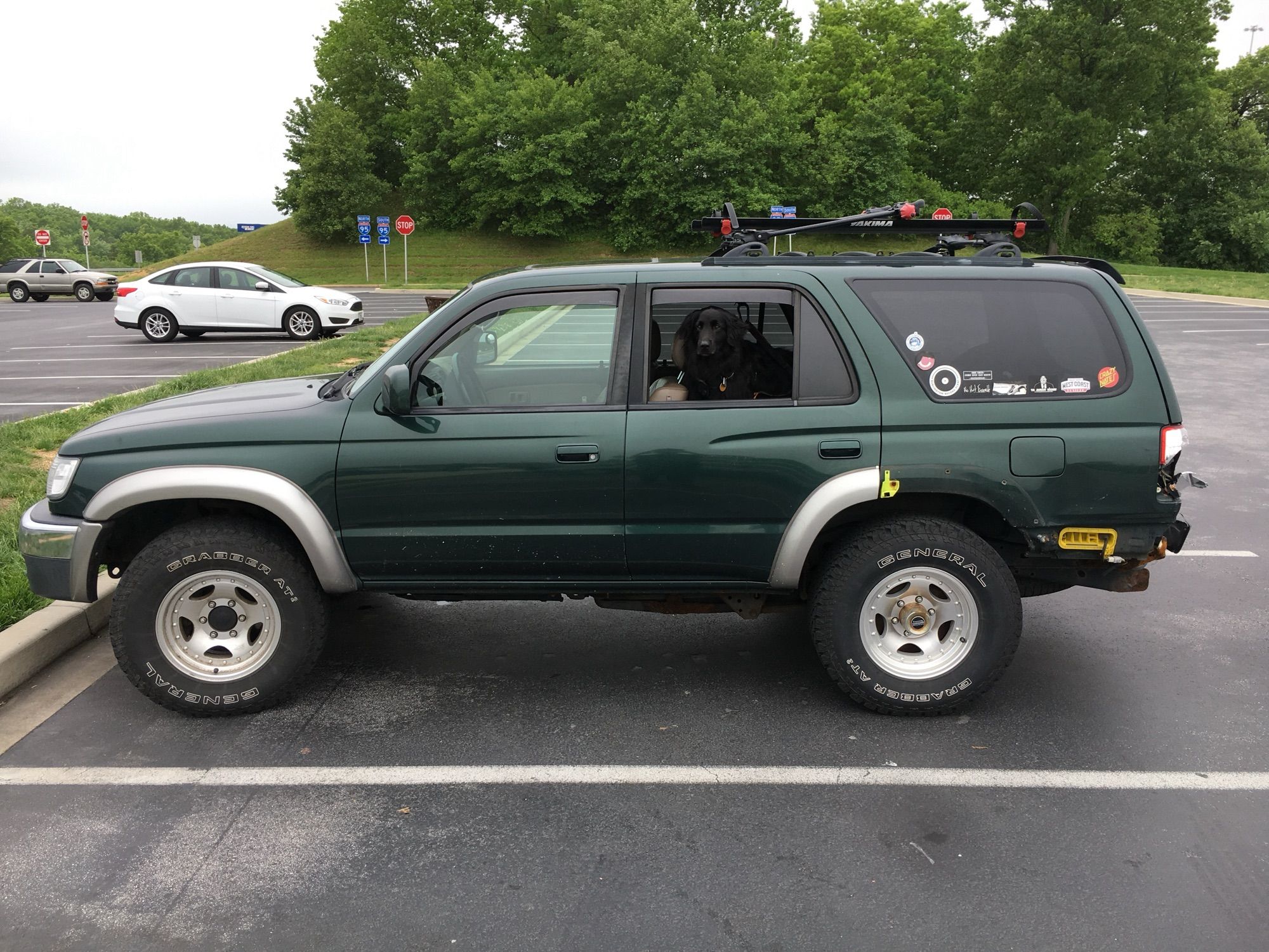 Toyertle post-accident, rear-ended on 95 in CT. Still drove great all the way to VA and back, was sadly totaled out once I got home and had it appraised. Pictured here with our beloved dog, Davis — both dearly missed.