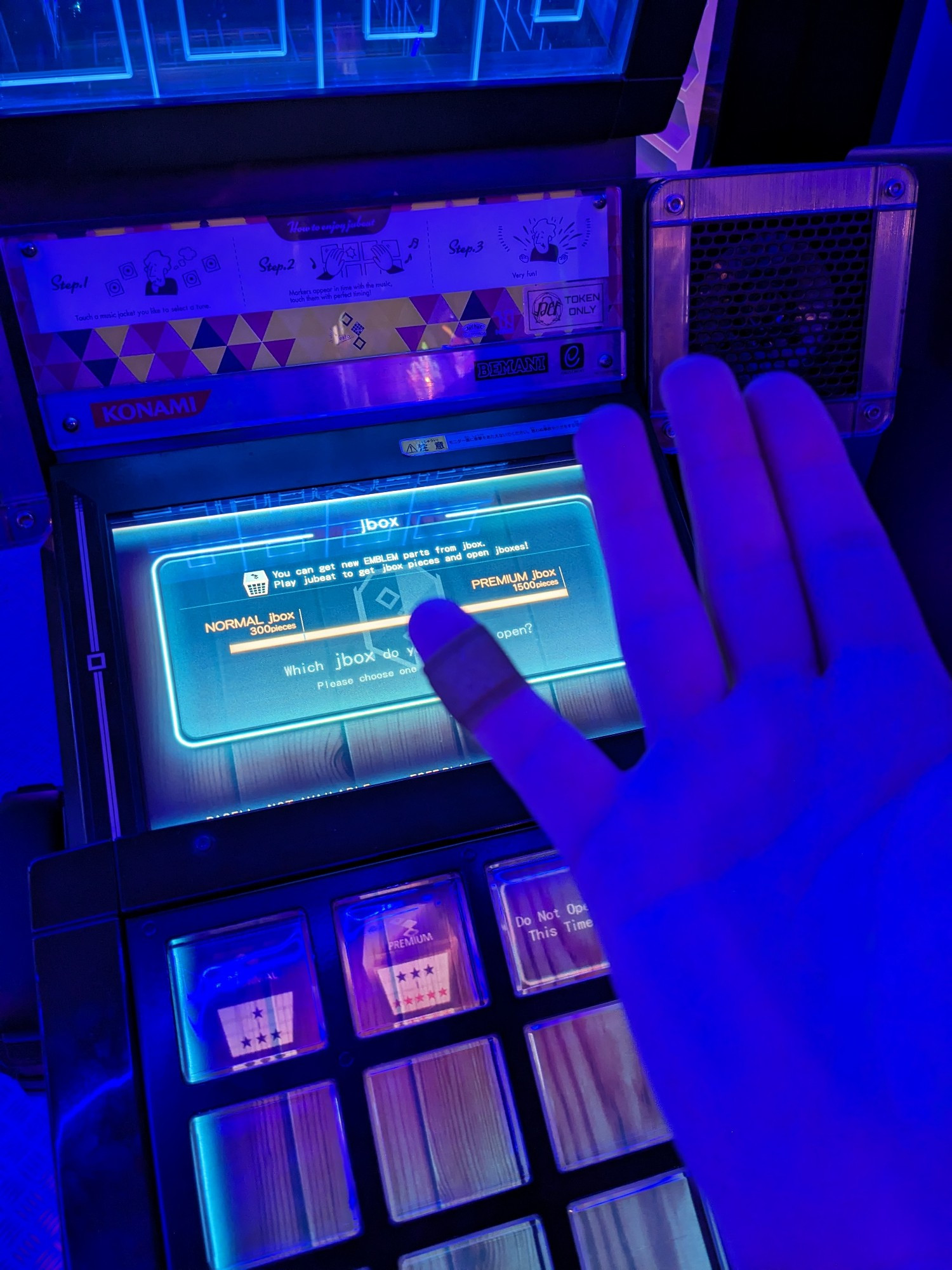 The same jubeat cab, but I'm showing my pinky wrapped in a band-aid in front of it