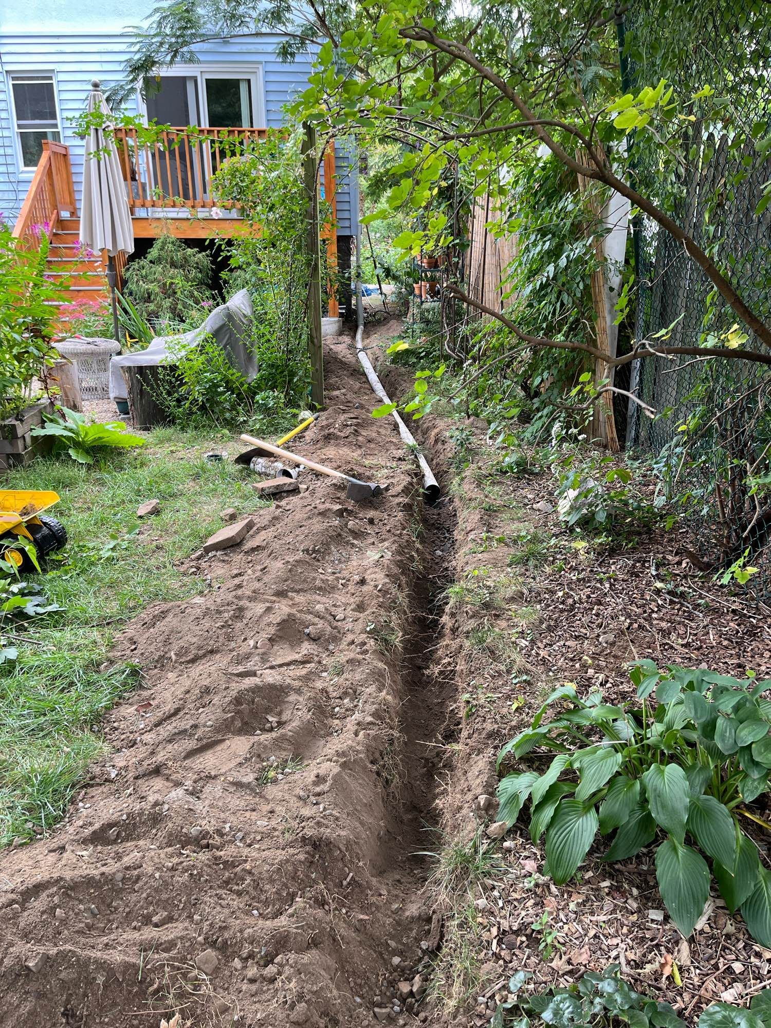 35-ft long ditch, with partially run sump outflow pipe