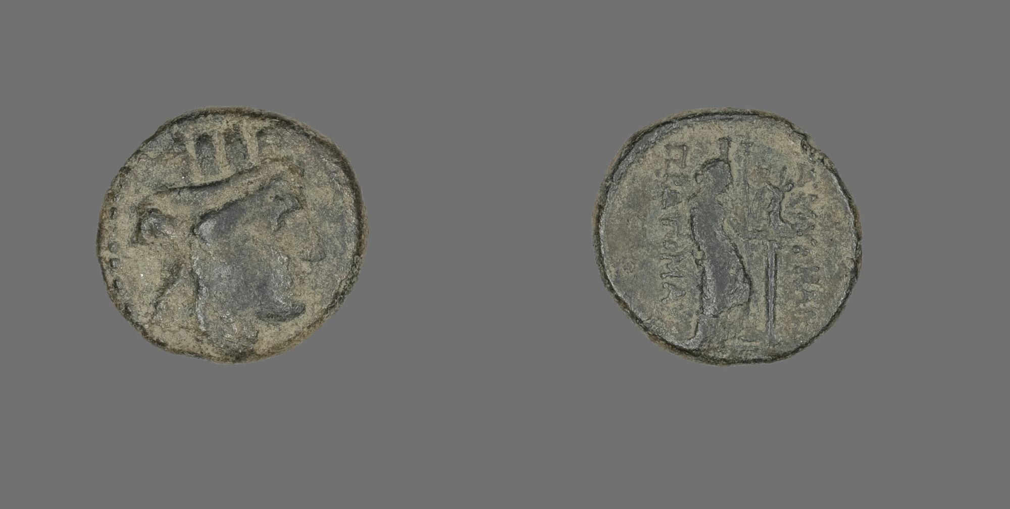 The front (obverse) of this coin depicts the head of the goddess Kybele, facing right. On the back (reverse), the goddess Aphrodite Stratonikis is depicted standing and facing right, holding a small figure of the goddess Nike.

Gift of William F. Dunham