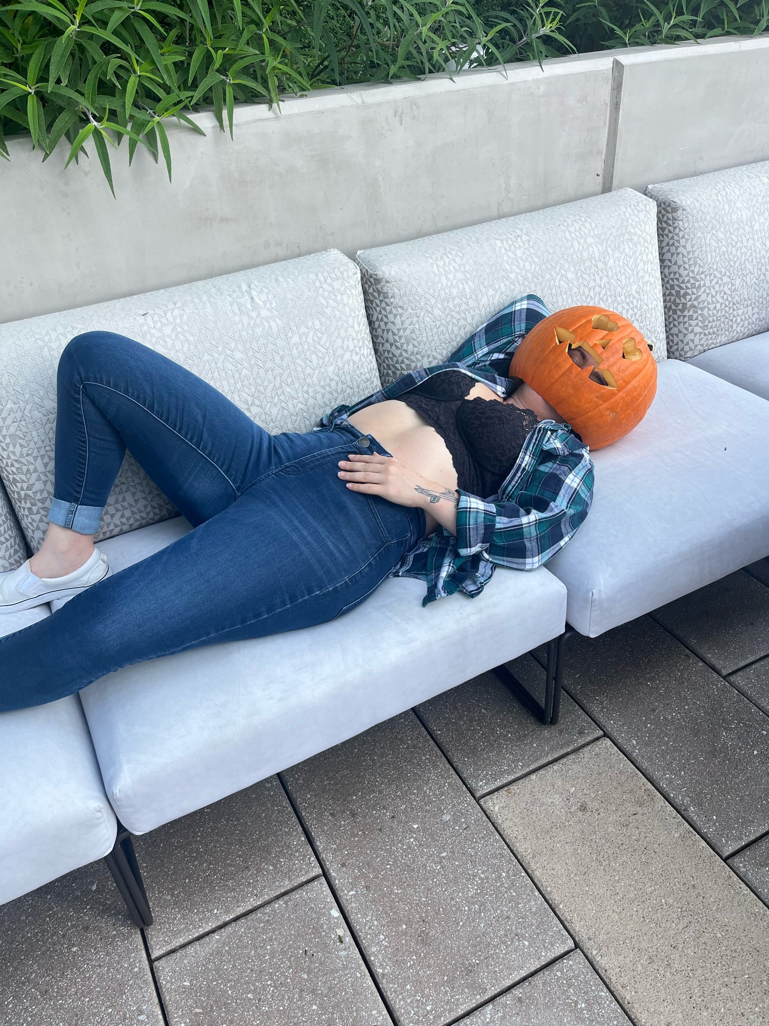 This is a photo of jes with a pumpkin on their head 