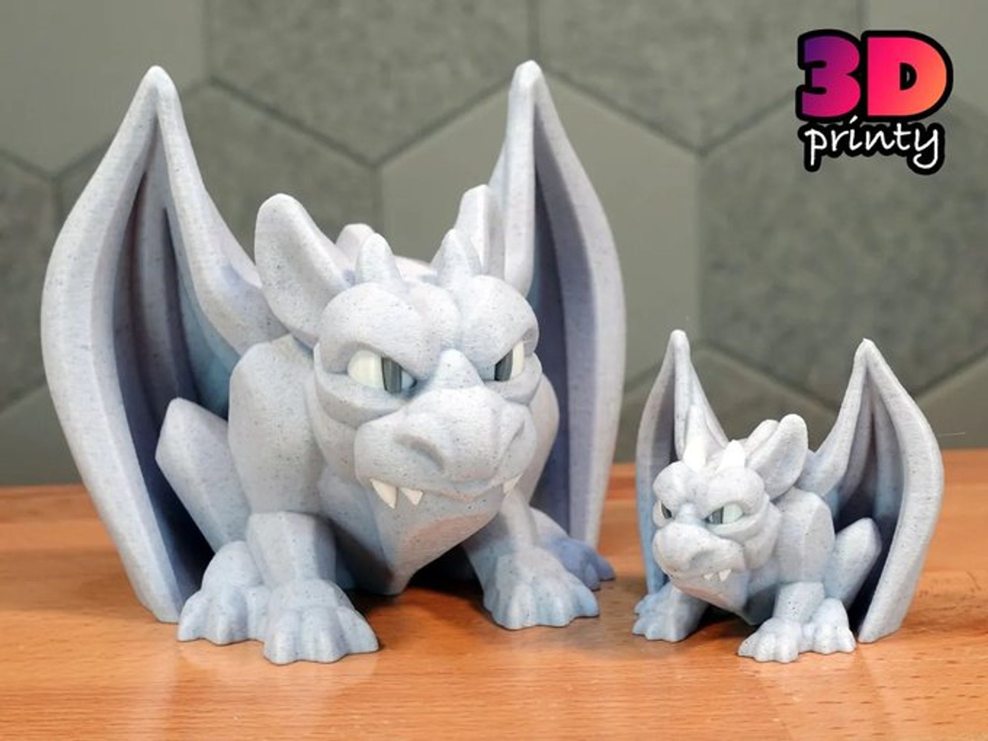 Photo of two 3D printed gargoyles. The gargoyle on the left is 200% scale (about 100mm tall) and the print on the right is 100% scale.