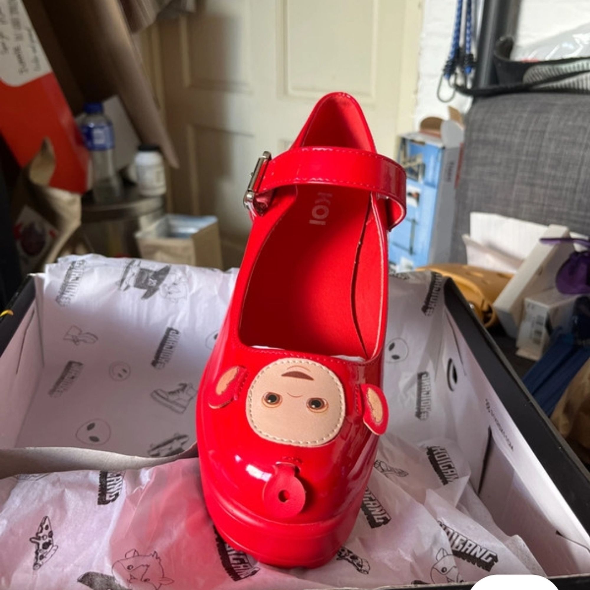 A teletubby shaped red mary jane shoe