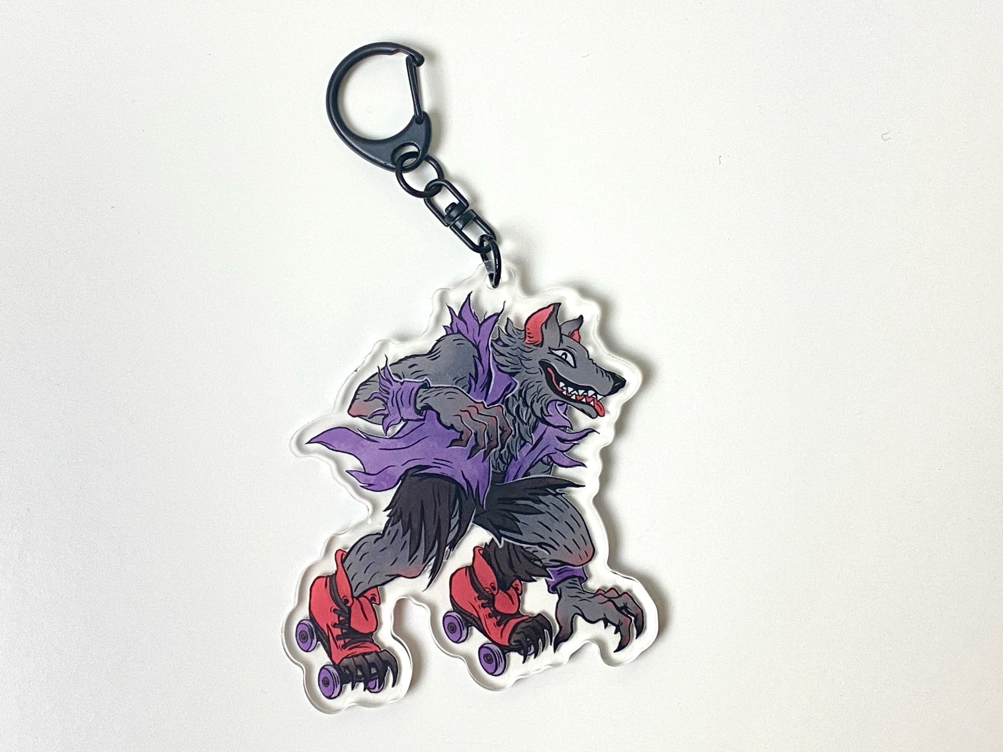 Werewolf rollerskater acrylic keychain.