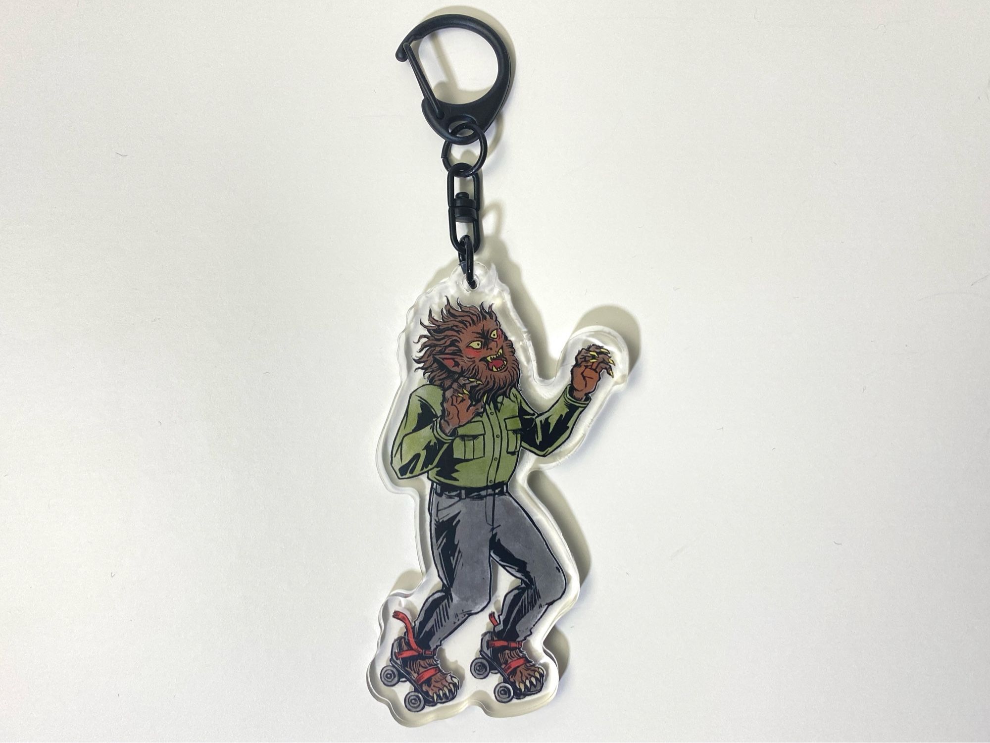 The Wolfman rollerskater acrylic keychain.