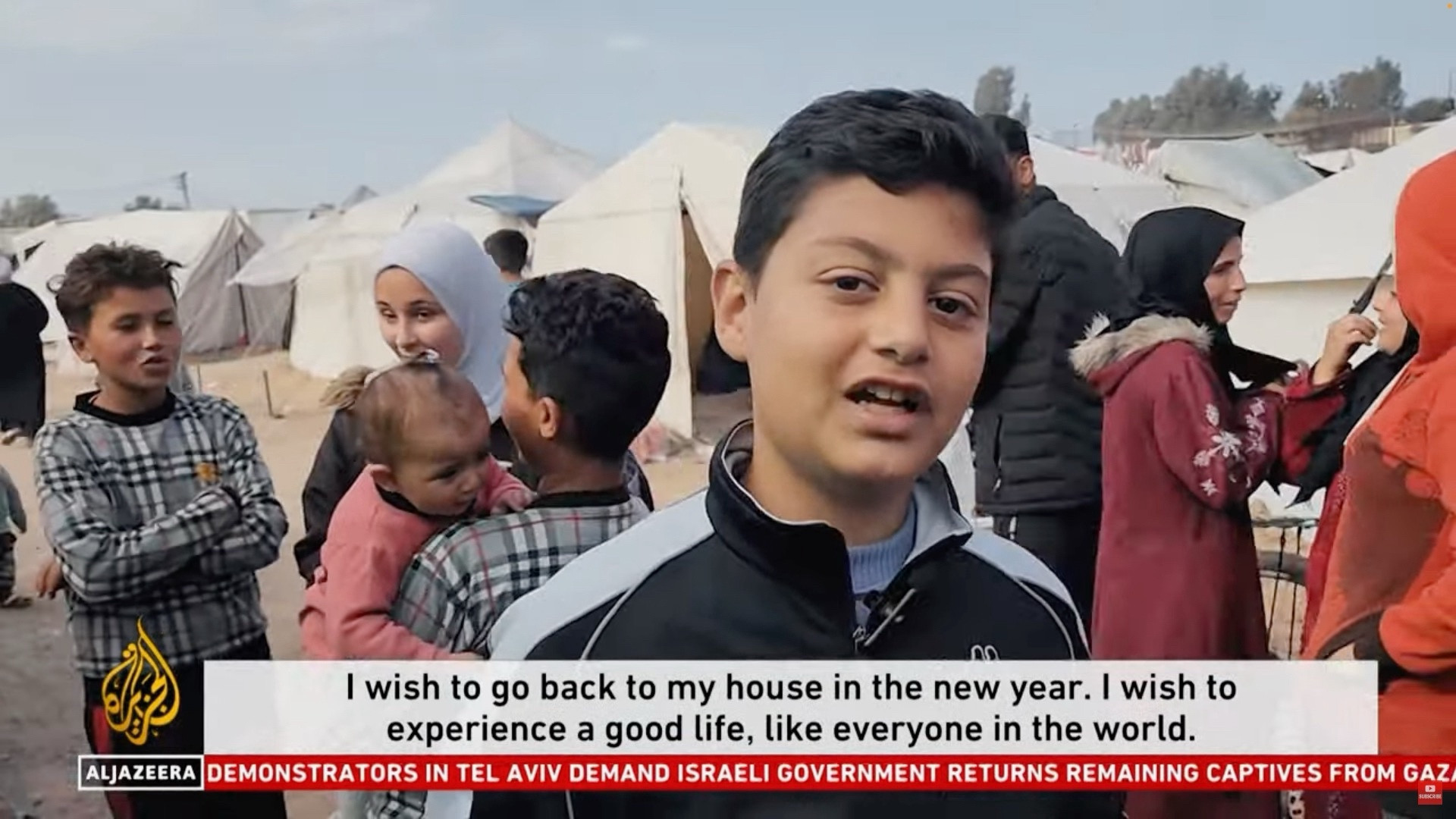 A boy saying: “I wish to go back to my house in the new year. I wish to experience a good life, like everyone in the world.”