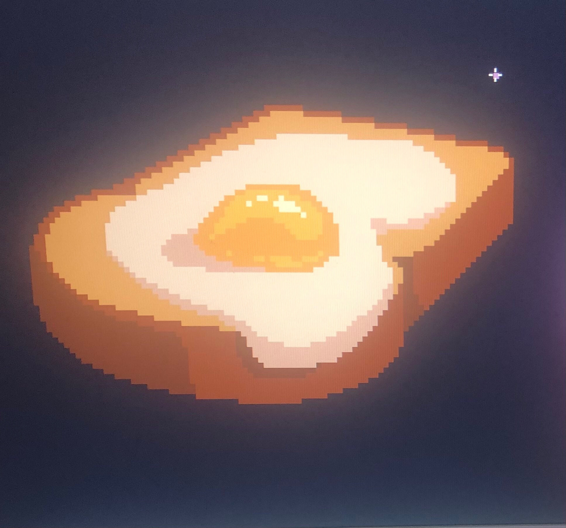 Pixel art of a piece of toast with a fried egg on top