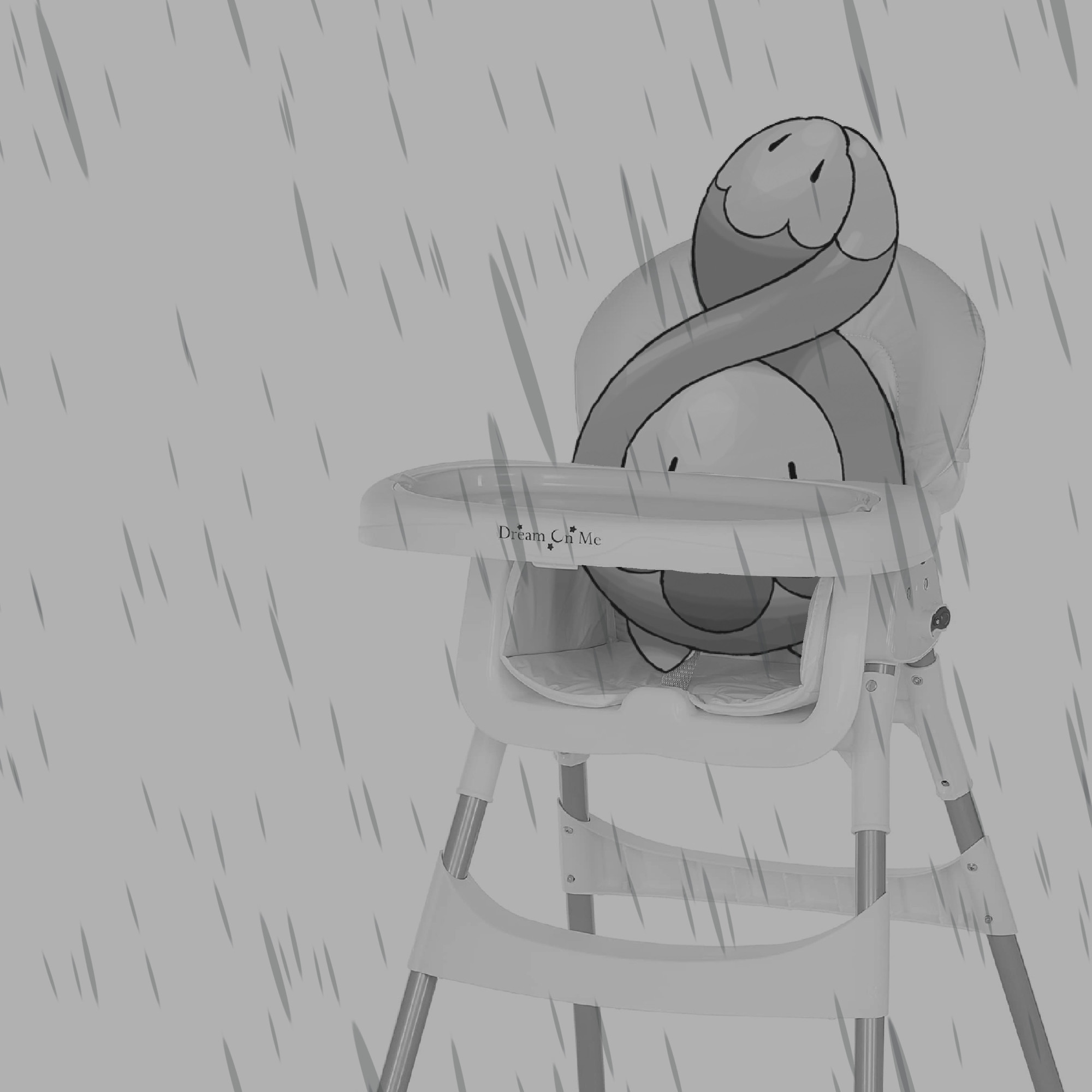 Atmospheric grayscale image depicting stock artwork of Budew sitting in a real photo of a high chair for babies. Rain fills the foreground to add to the atmosphere.