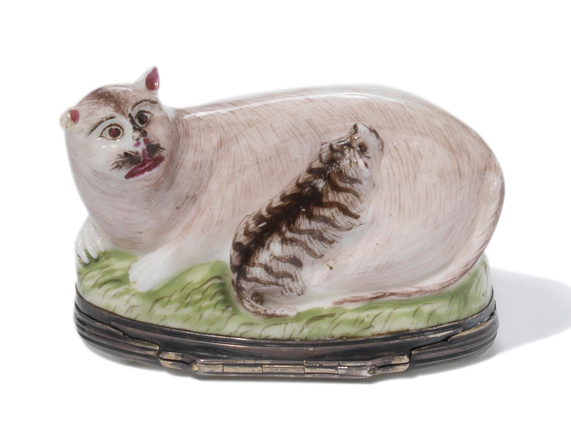 Photo of a ceramic box in the shape of a mother cat and kitten. The bodies of both the light brown mother and tabby kitten are painted with small, fine strokes to create fur texture. They are reclining on a grassy surface. Here's the thing, though - the mom's face is extremely comical.  She looks like a Burt Reynolds puppet painted by a small child. She has distinct humanoid eyebrows over human eyes, a humanoid nose with two large, round, dark pink nostrils, a big dark brown bushy mustache that was supposed to be whiskers I guess, and finally a wide mouth that is thickly painted with dark pink glaze like she tried to put on lipstick in the dark.