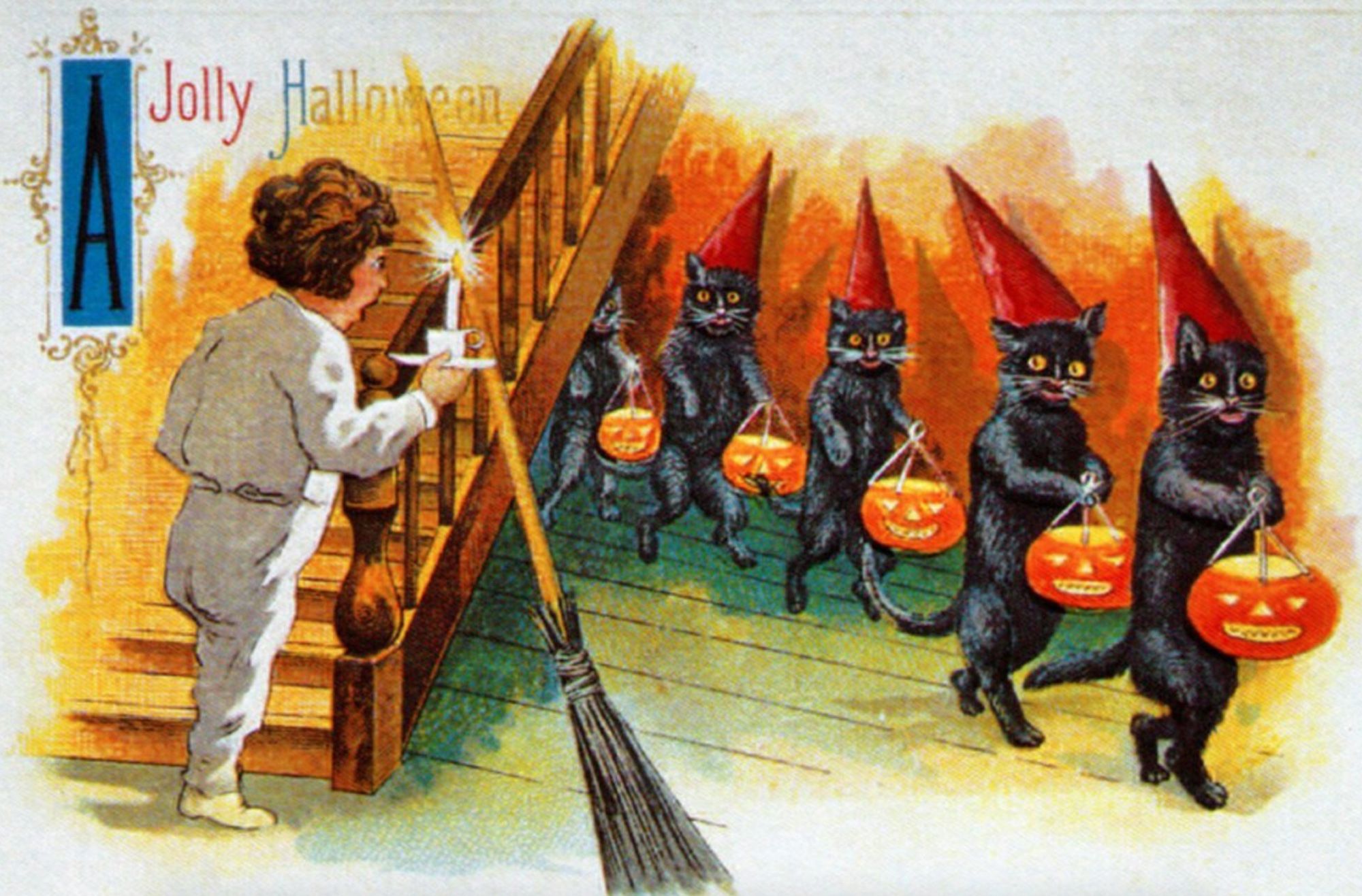 Color postcard with text in the upper left corner reading "A Jolly Halloween". A child wearing white pajamas is holding a candle by a staircase. The child looks on in surprise as a procession of black cats walking on their hind legs and holding jack-o-lantern buckets, and wearing pointy red caps emerges in a line from under the stairs.