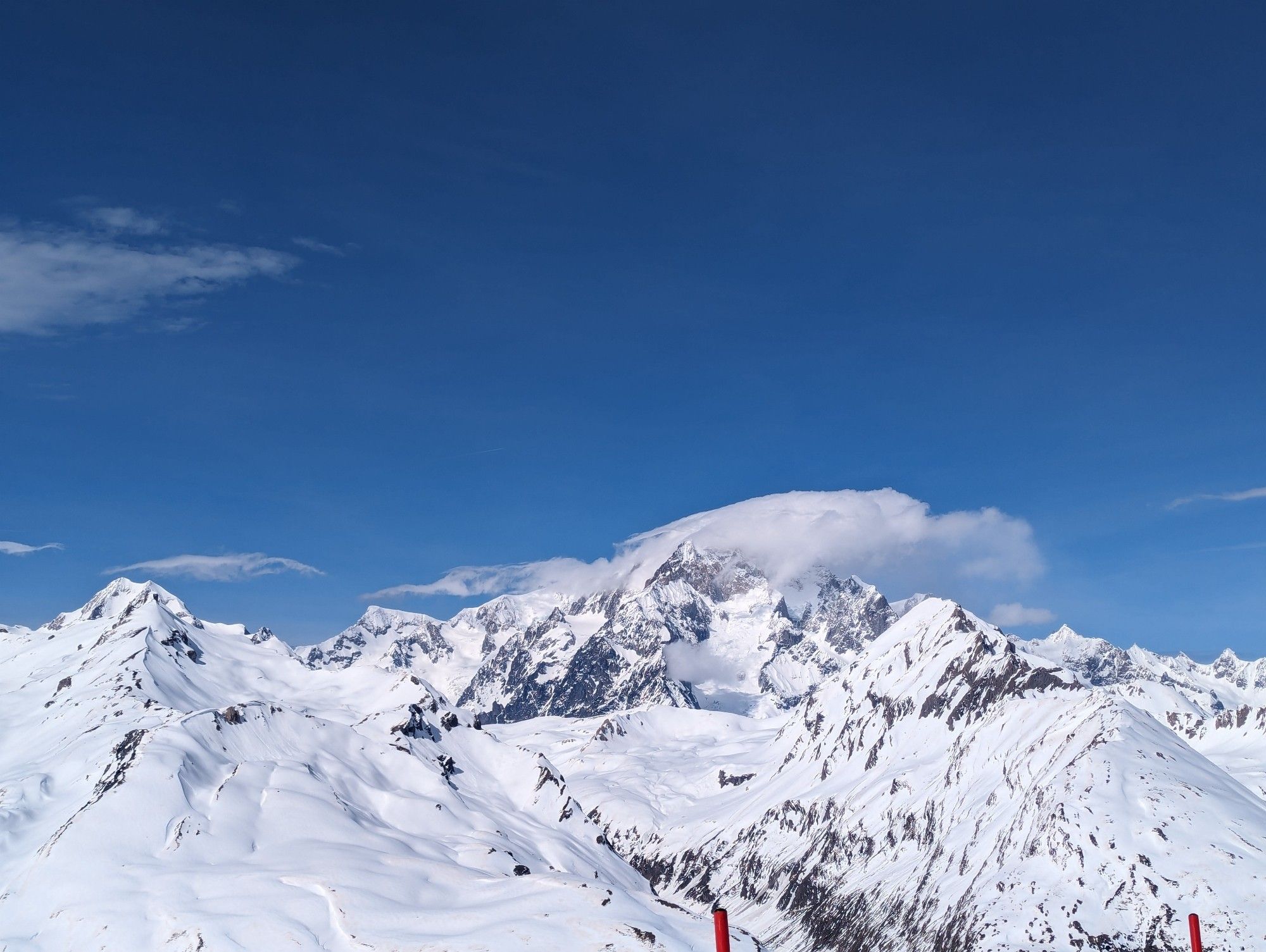 A view of Mont Blanc, with the summit obscured by light cloud