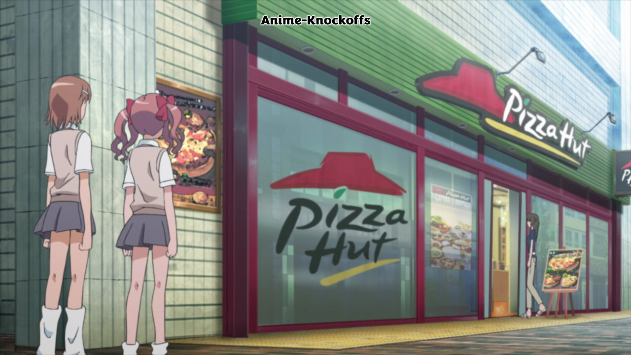 Two schoolgirls stand outside a Pizza Hut