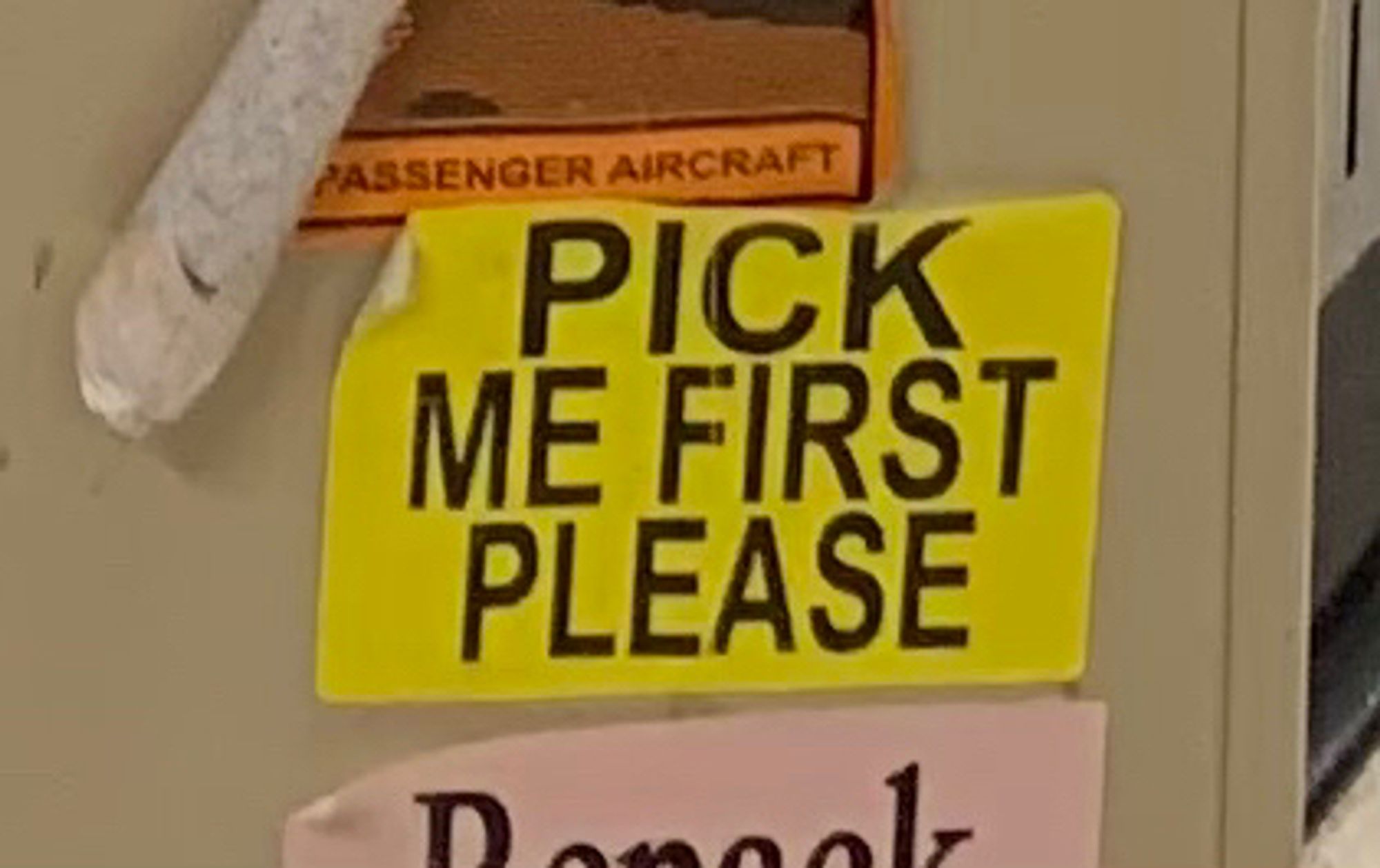 Yellow sticker “PICK ME FIRST PLEASE”