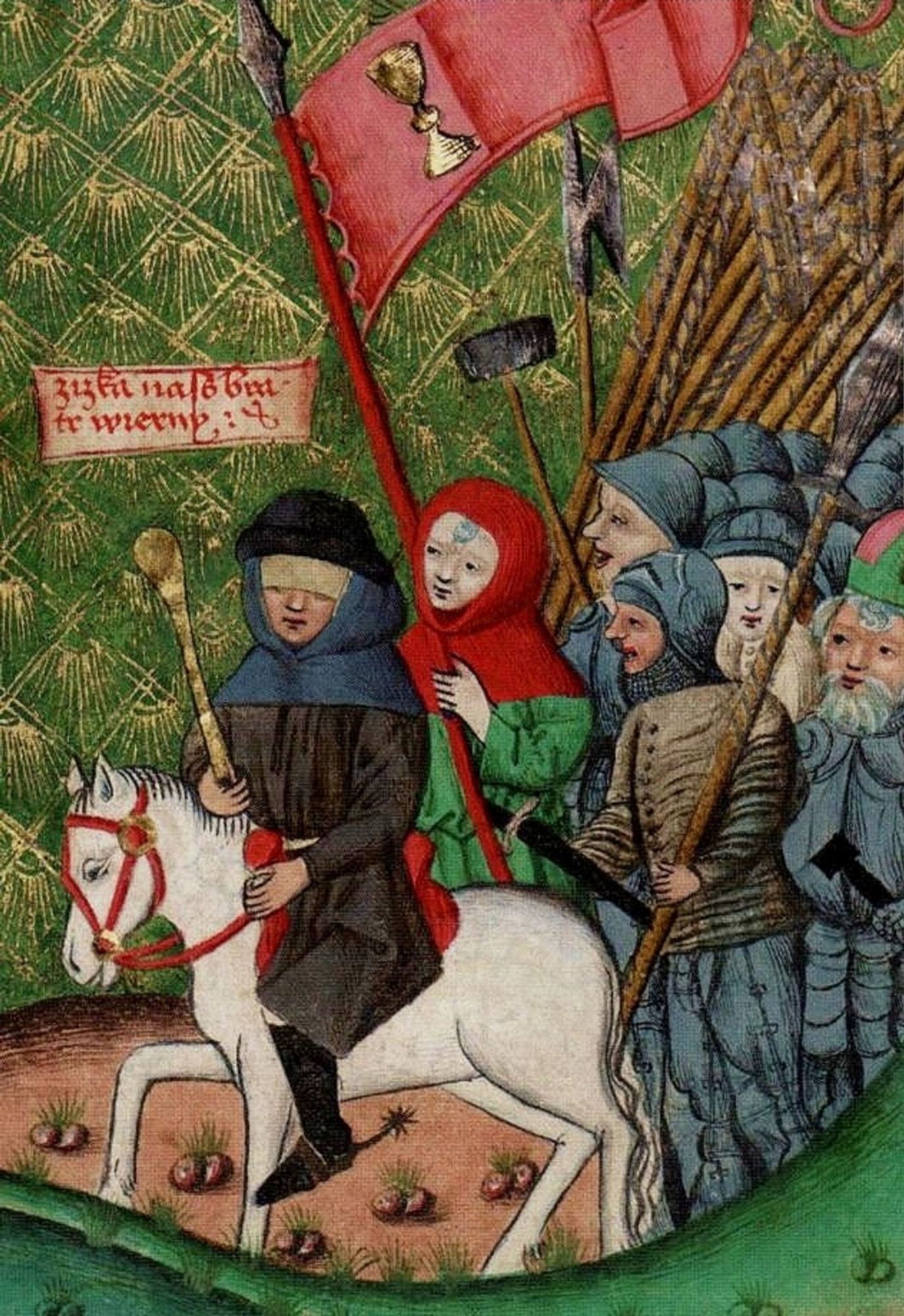 The brilliant tactician Jan Žižka, who led entire battles in the 1400s while completely blind, leading radical Hussite forces in an illustration from a contemporary chronicle. He's depicted in dark peasant clothes, blindfolded, holding a mace and riding a white horse. Their forces are brandishing their war flails and marching under a red banner with a chalice on it.