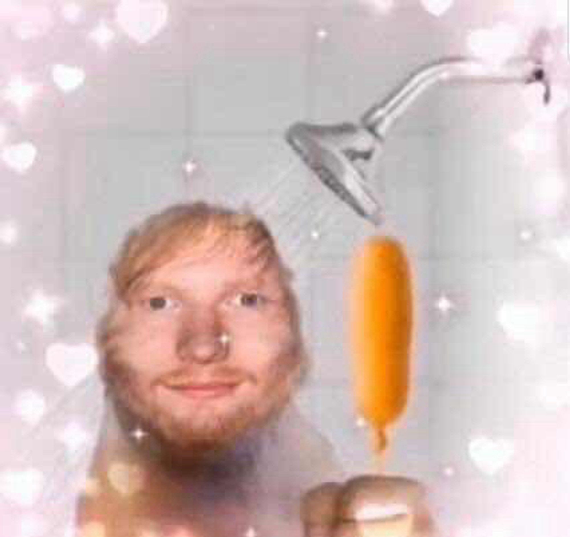 Ed Sheeran holding a corn dog in the shower. He has a whimsical twinkle in his eye. The vibes are akin to a newborn foal taking his first steps and seeing the wonder in the world