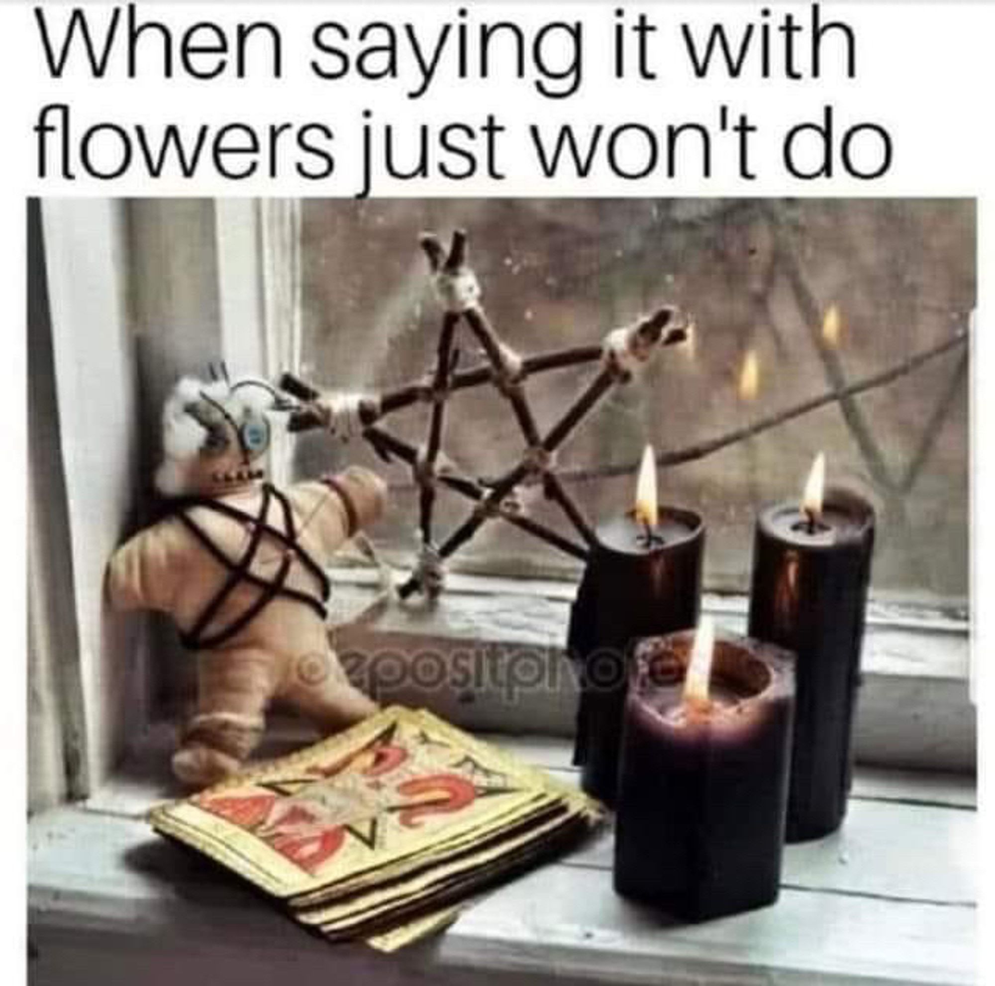 A picture of a voodoo doll, a pentagram, black candles, satanic card deck. 

Caption: when saying it with flowers just won't do.