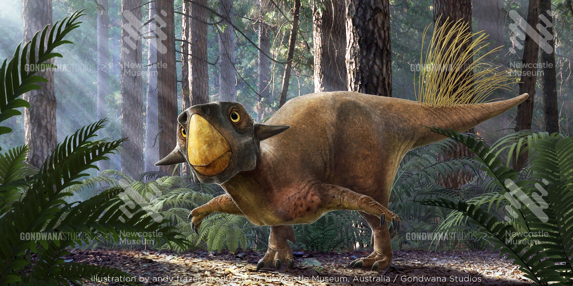 A small brown dinosaur with a bright yellow beak, and long golden quills on his tail stands in a forest clearing, bent low, arms outstretched. Rays of sunlight break through the trees above, spotlighting him.