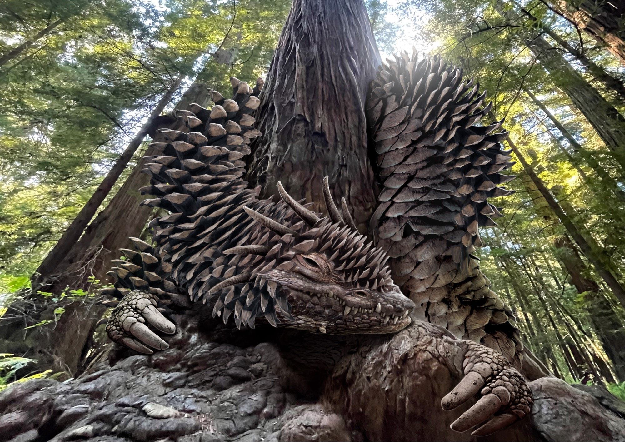 A giant, serpentine dragon, with scales that look like those on a pinecone, lies curled around the base of a large tree in a forest.