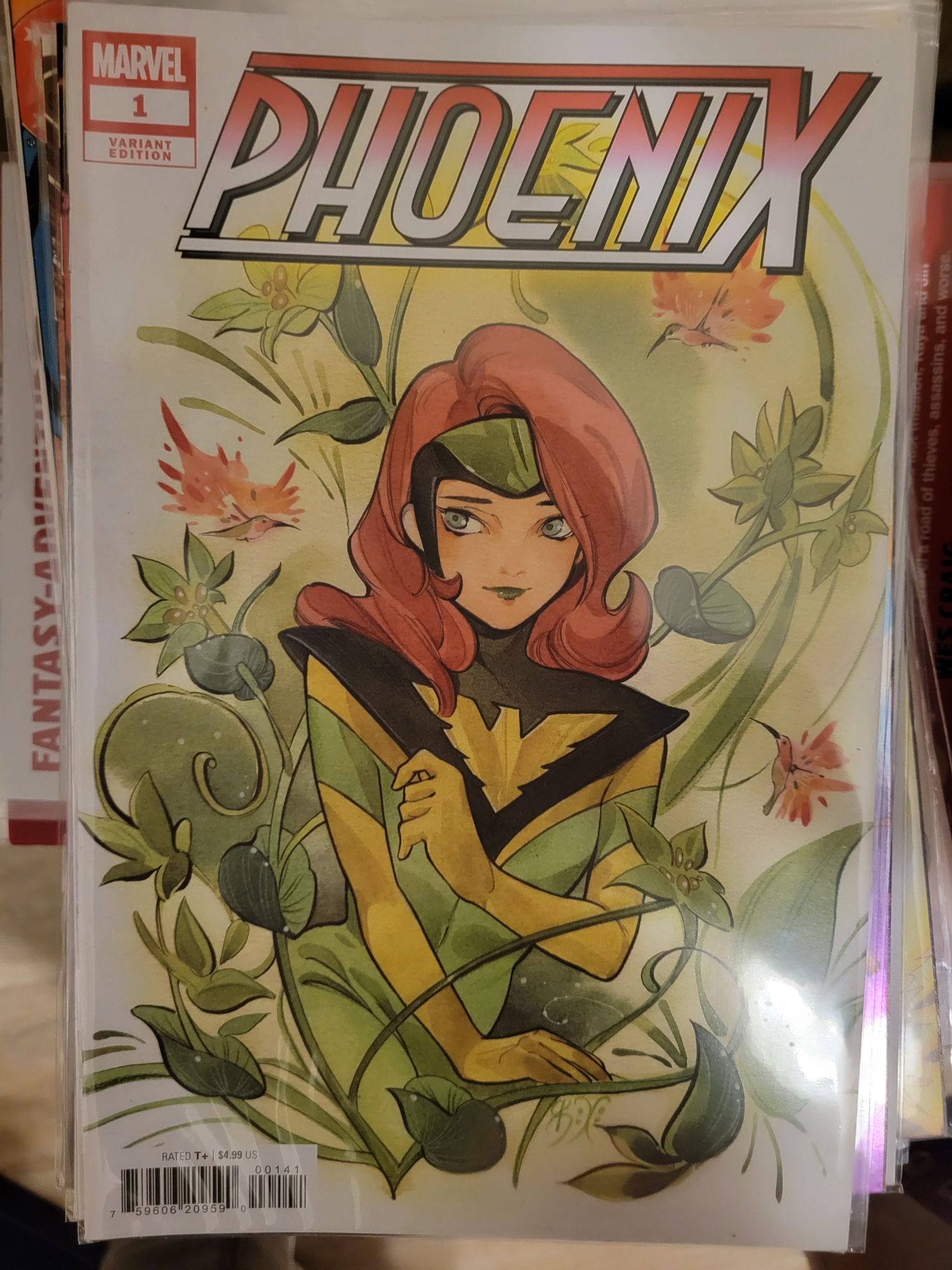 Variant cover for Phoenix #1 by Peach Momoko, with Jean Grey in her new Phoenix costume against a white background surrounded by greenery and blossoms (Marvel Comics, 2024)