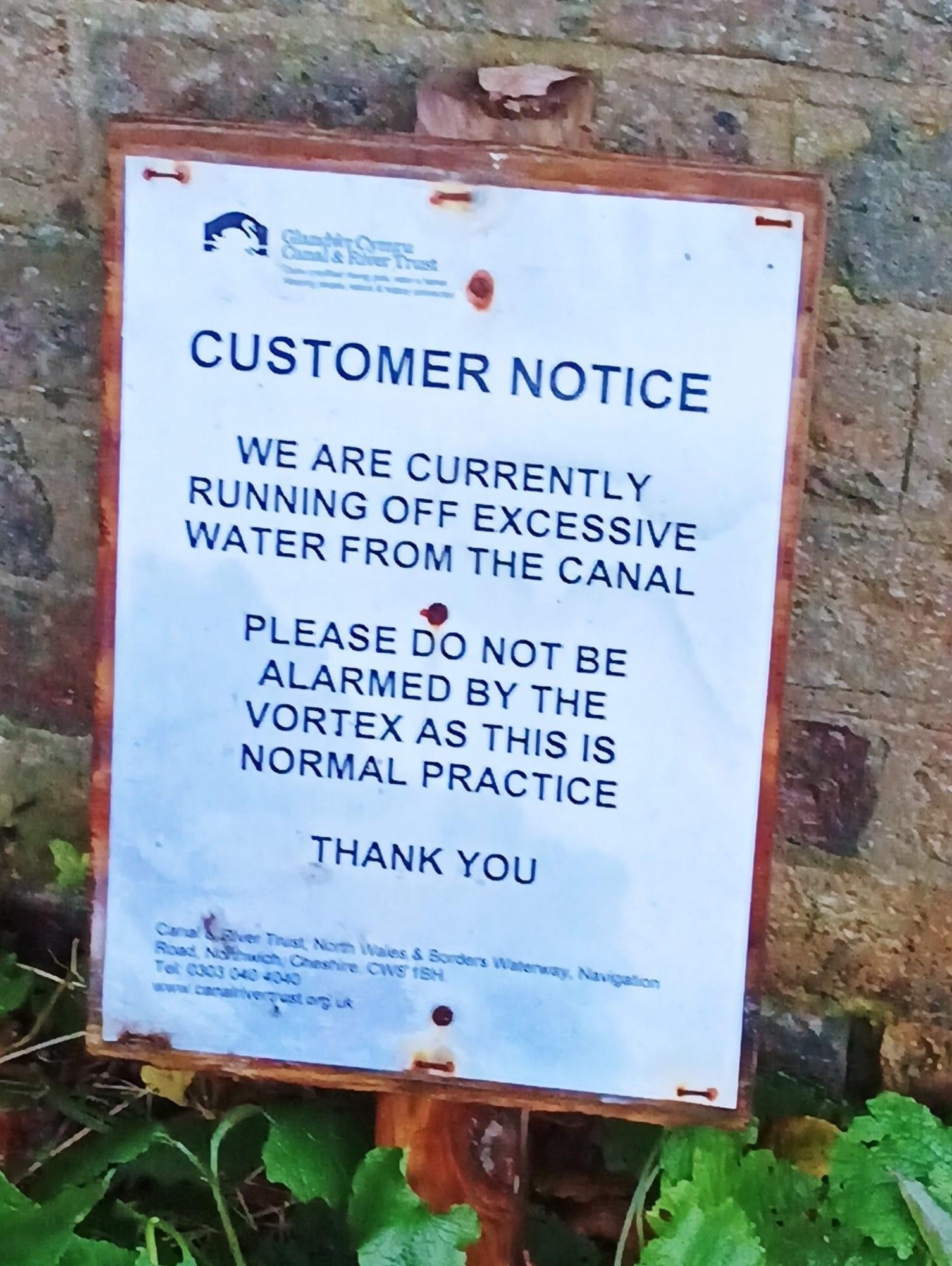 A sign outside reading:

CUSTOMER NOTICE

WE ARE CURRENTLY RUNNING OFF EXCESSIVE WATER FROM THE CANAL

PLEASE DO NOT BE ALARMED BY THE VORTEX ADD THIS IS NORMAL PRACTICE

THANK YOU