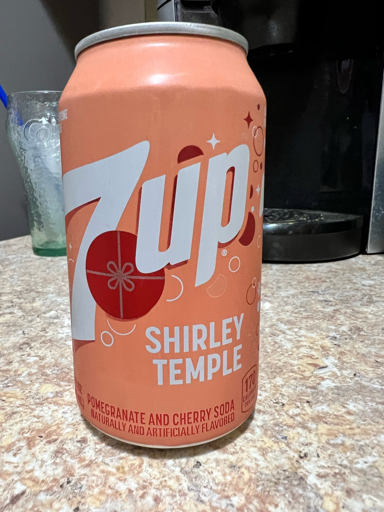 Peach 7up can with the words Shirley Temple on it. A pomegranate and cherry soda. 