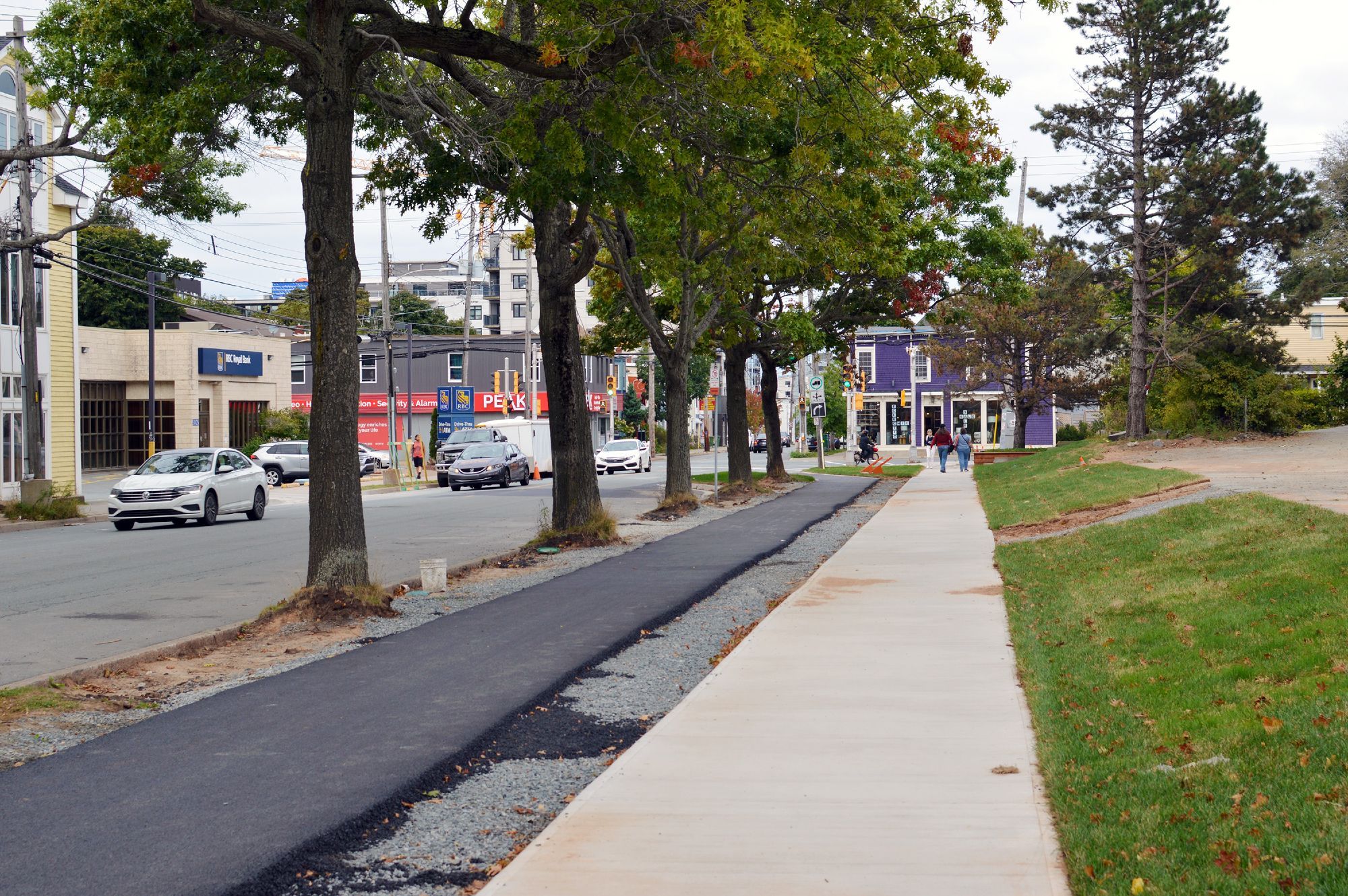 Newly built sidewalk and asphalt bike lane on the south side of Almon Street adjacent to the Bloomfield Centre.