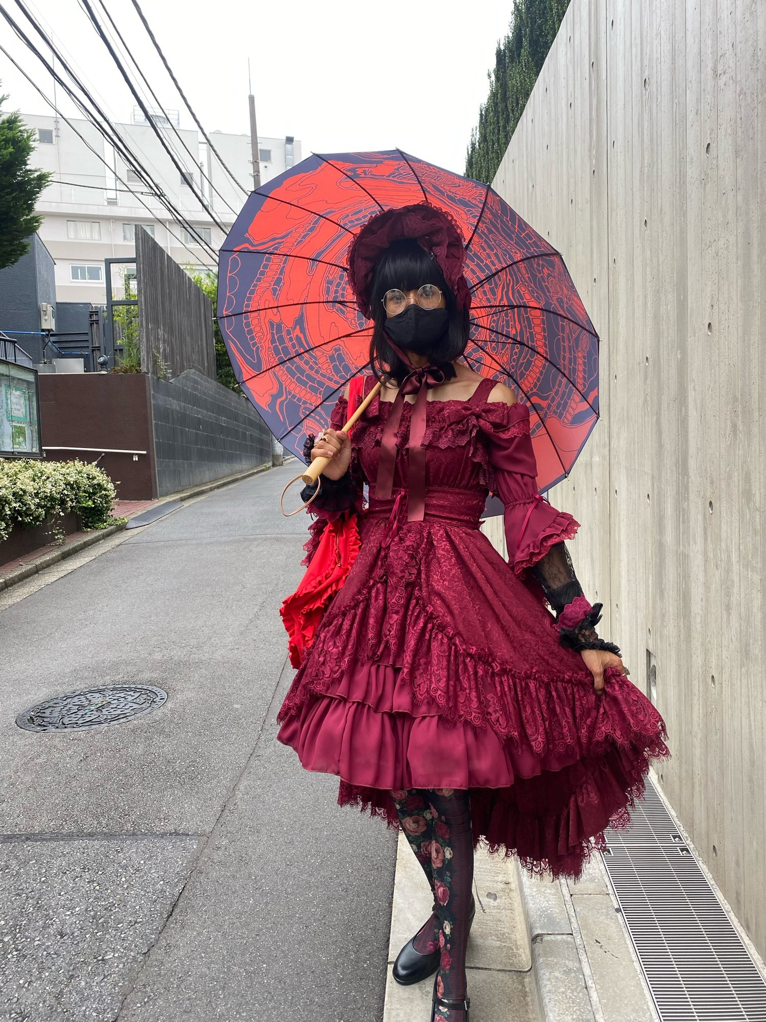 A picture of me wearing a gothic Lolita coordinate with red as a primary colour.