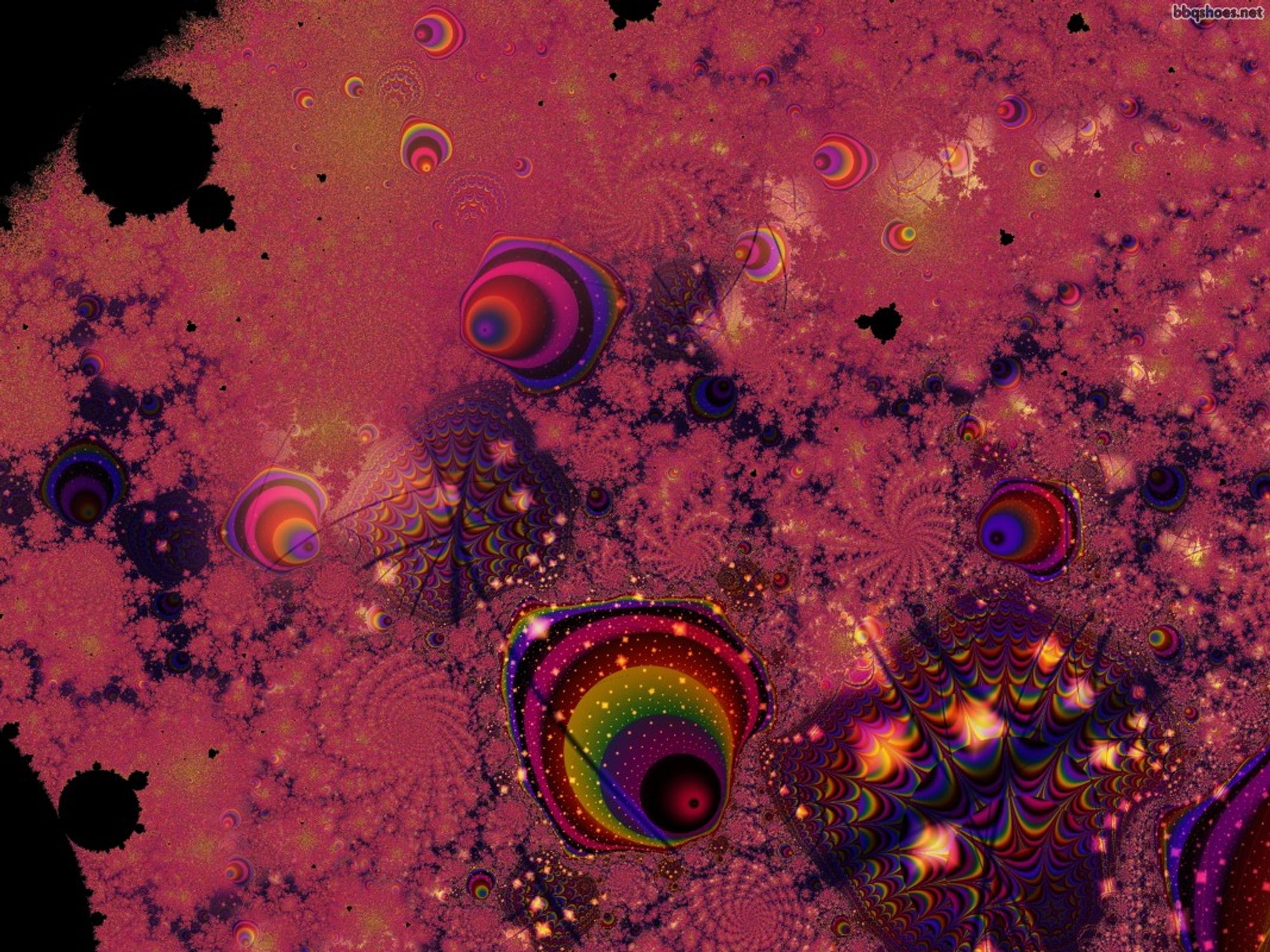 Night shaded subdued red fractal patterning with small rainbow blobs against inverted mandelbrot shapes