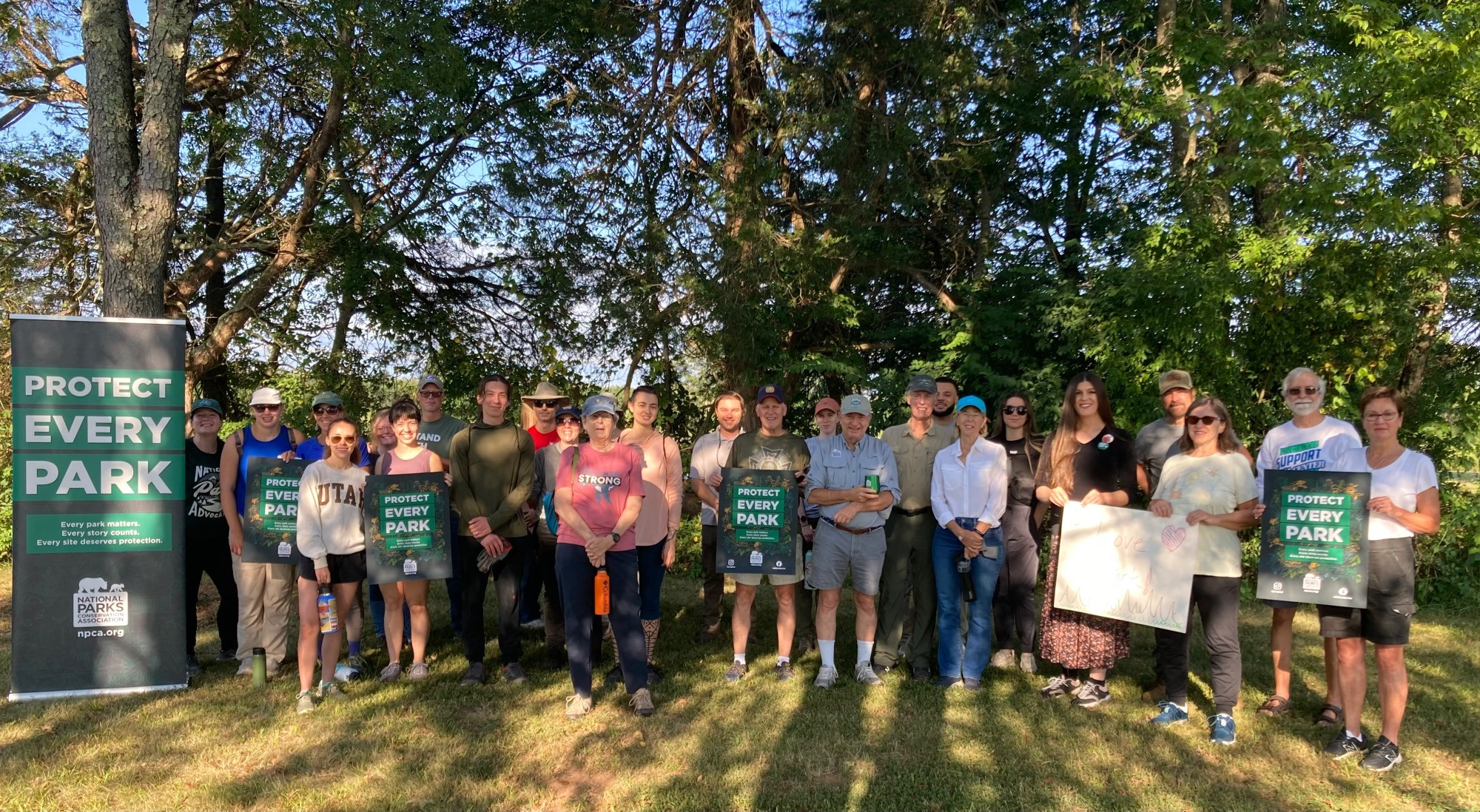 Danica stands with volunteers who came out to Brawner’s Farm on the western end of Manassas National Battlefield Park this morning under trees and shade.