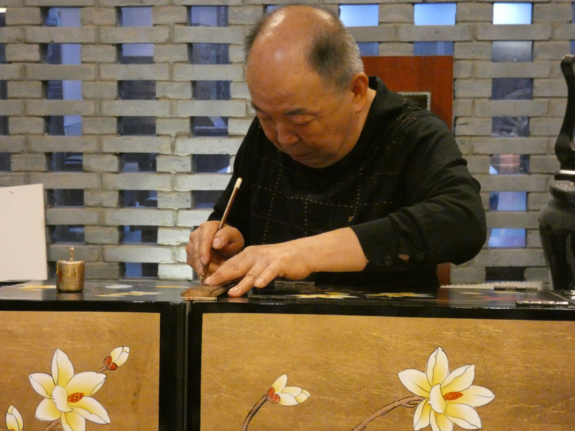 Artist making lacquer ware