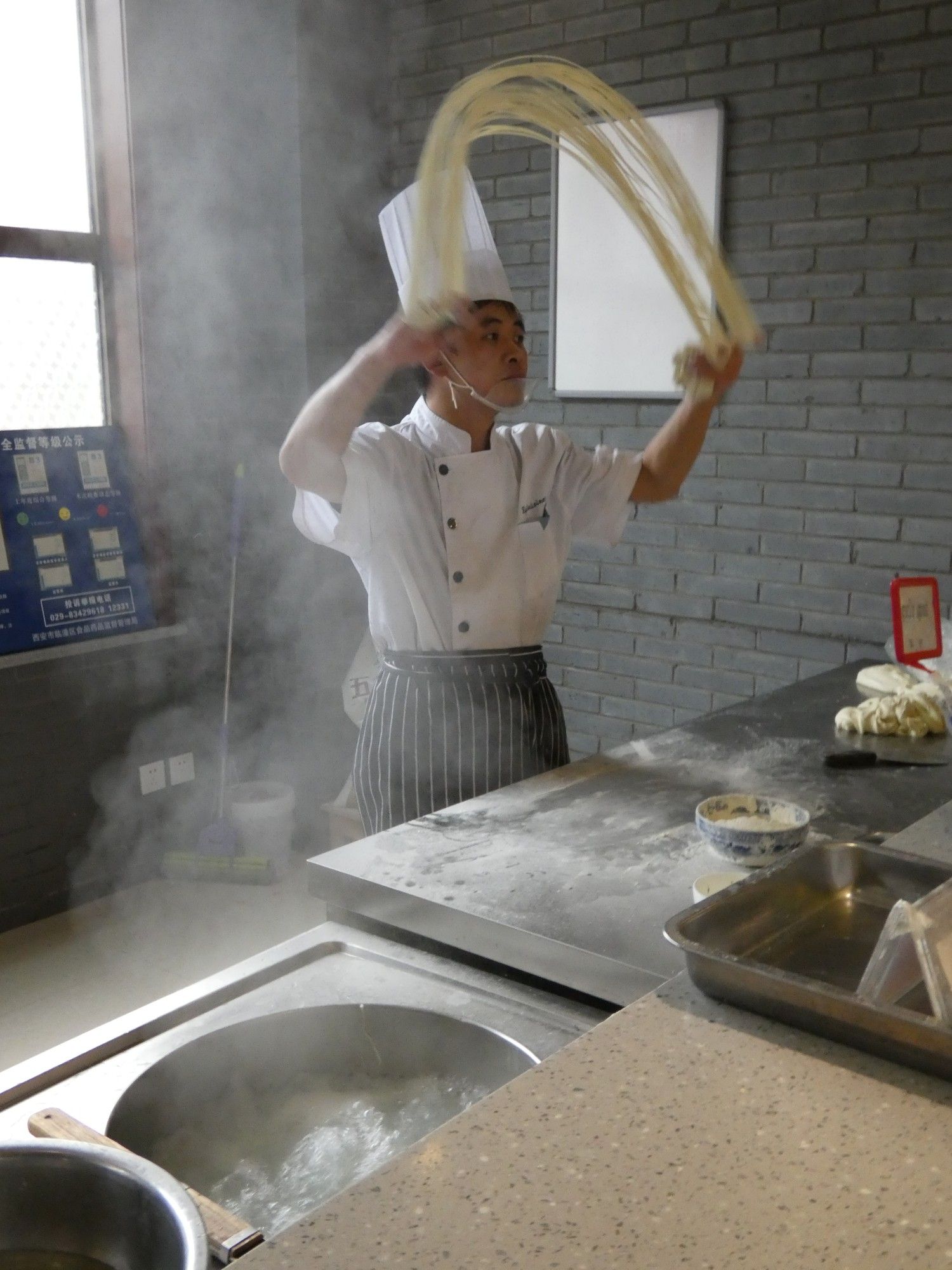 Chef making long noodles for our lunch